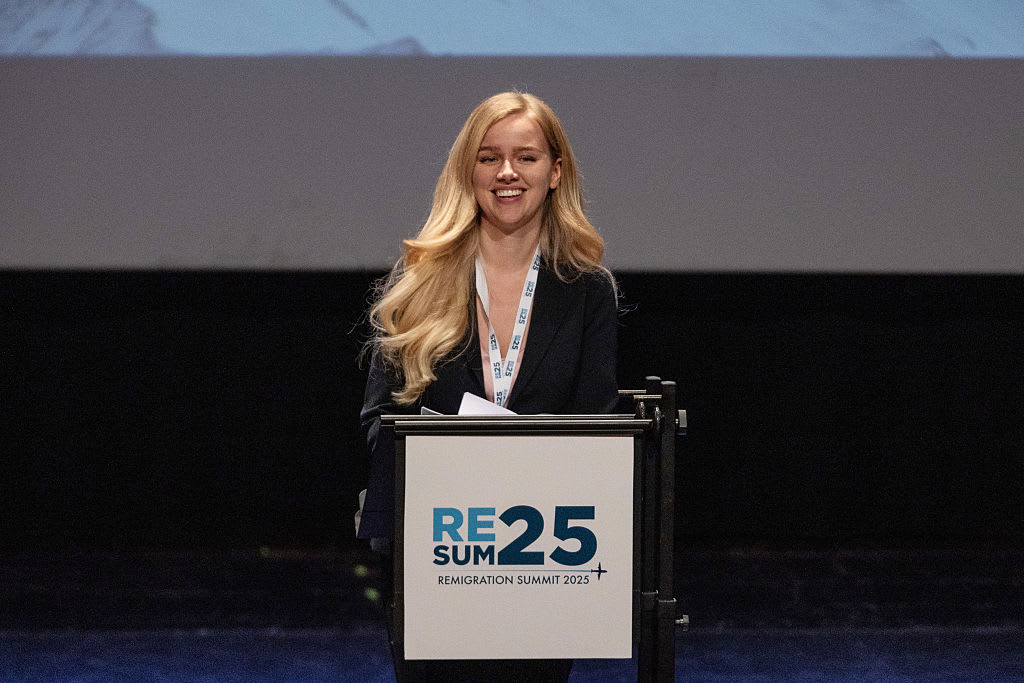 Dutch conservative political commentator and activist Eva Vlaardingerbroek delivers a speech during the first “Remigration Summit” at Teatro Condominio on May 17, 2025, in Gallarate, Italy. She was recently barred by the U.K. government from entering the U.K., deemed “not conducive to the public good.” | Credit: Emanuele Cremaschi/Getty Images)