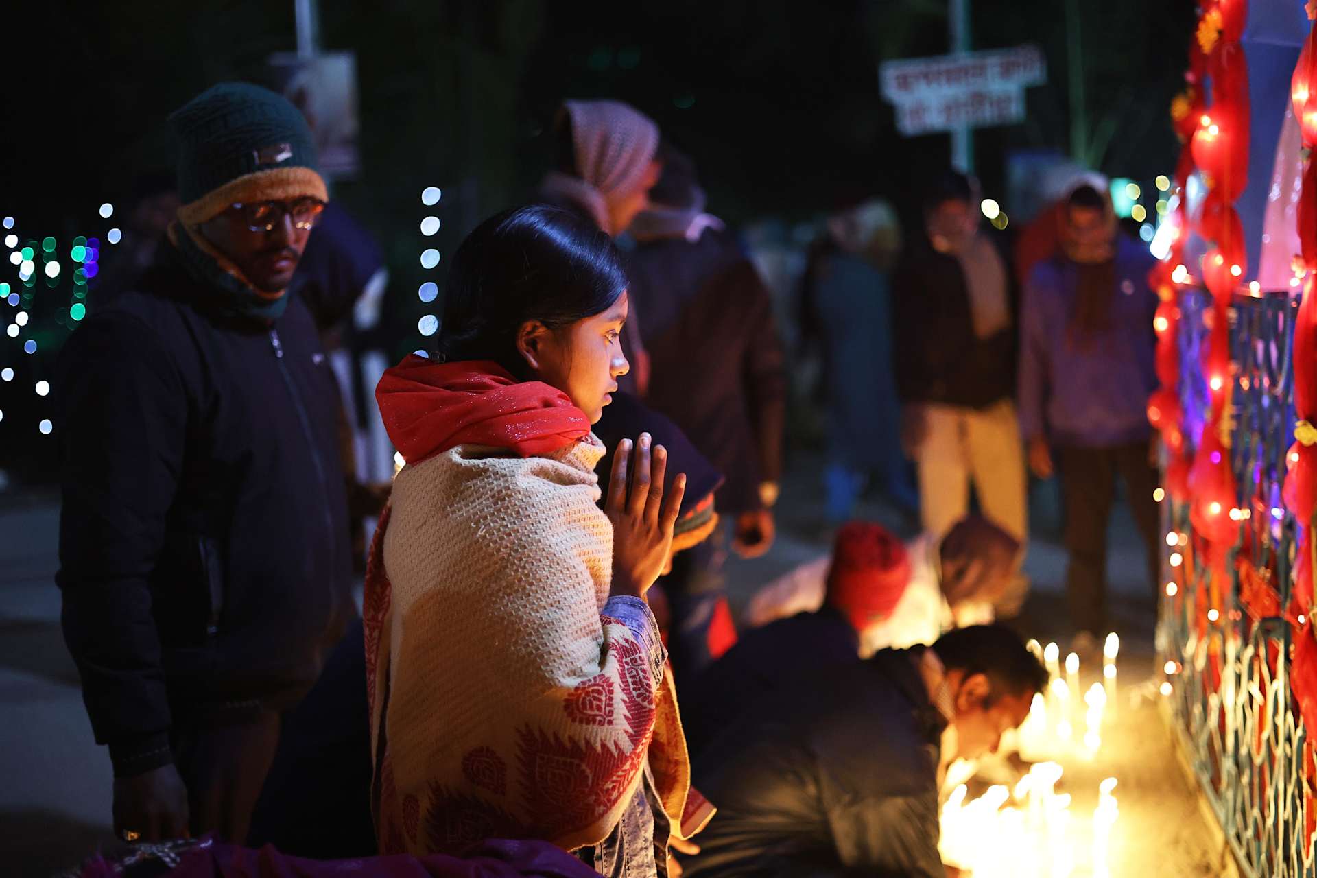 A girl prays at the grotto of Mary in Nabai Battala, Bangladesh, on Jan. 15, 2026. | Credit: Stephan Uttom Rozario