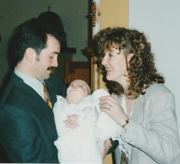 Joe at his baptism with his parents, Alan and Veronica. | Credit: Joe Wilson Association
