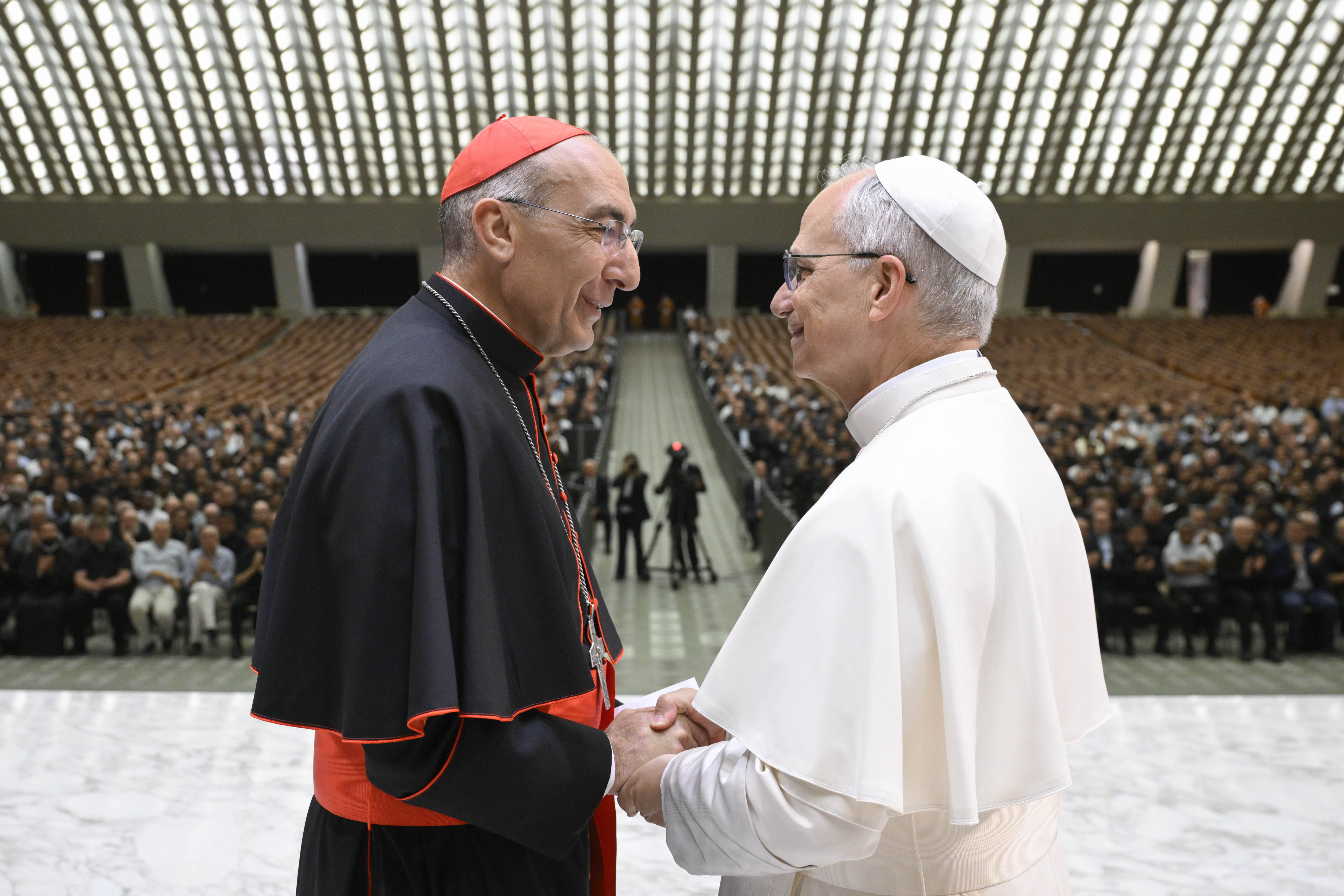 Pope Leo XIV shakes hands with Cardinal Baldassare Reina, vicar general of Rome, during a meeting with priests of the Rome Diocese at the Vatican on June 12, 2025. | Credit: Vatican Media