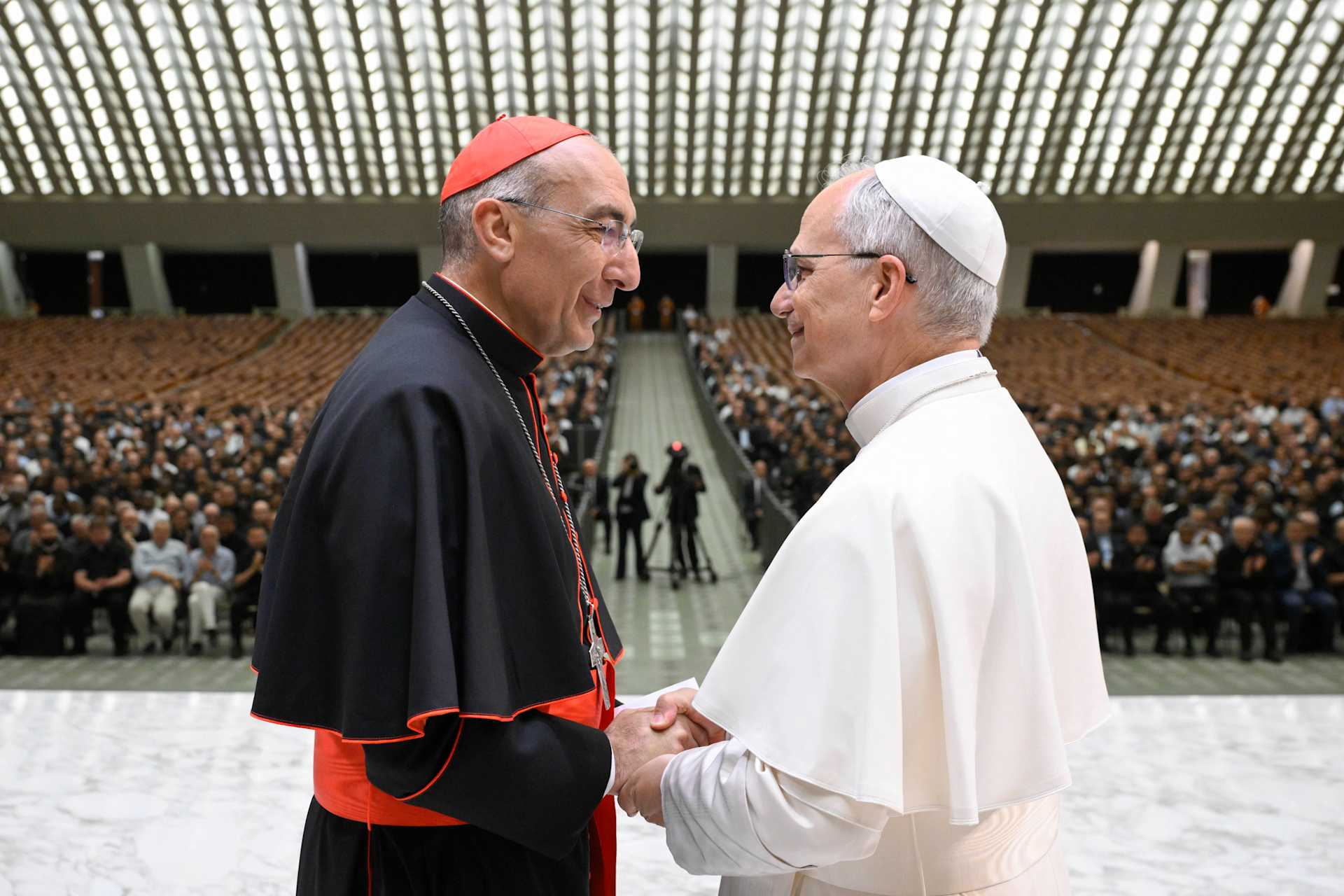 Pope Leo XIV shakes hands with Cardinal Baldassare Reina, vicar general of Rome, during a meeting with priests of the Rome Diocese at the Vatican on June 12, 2025. | Credit: Vatican Media
