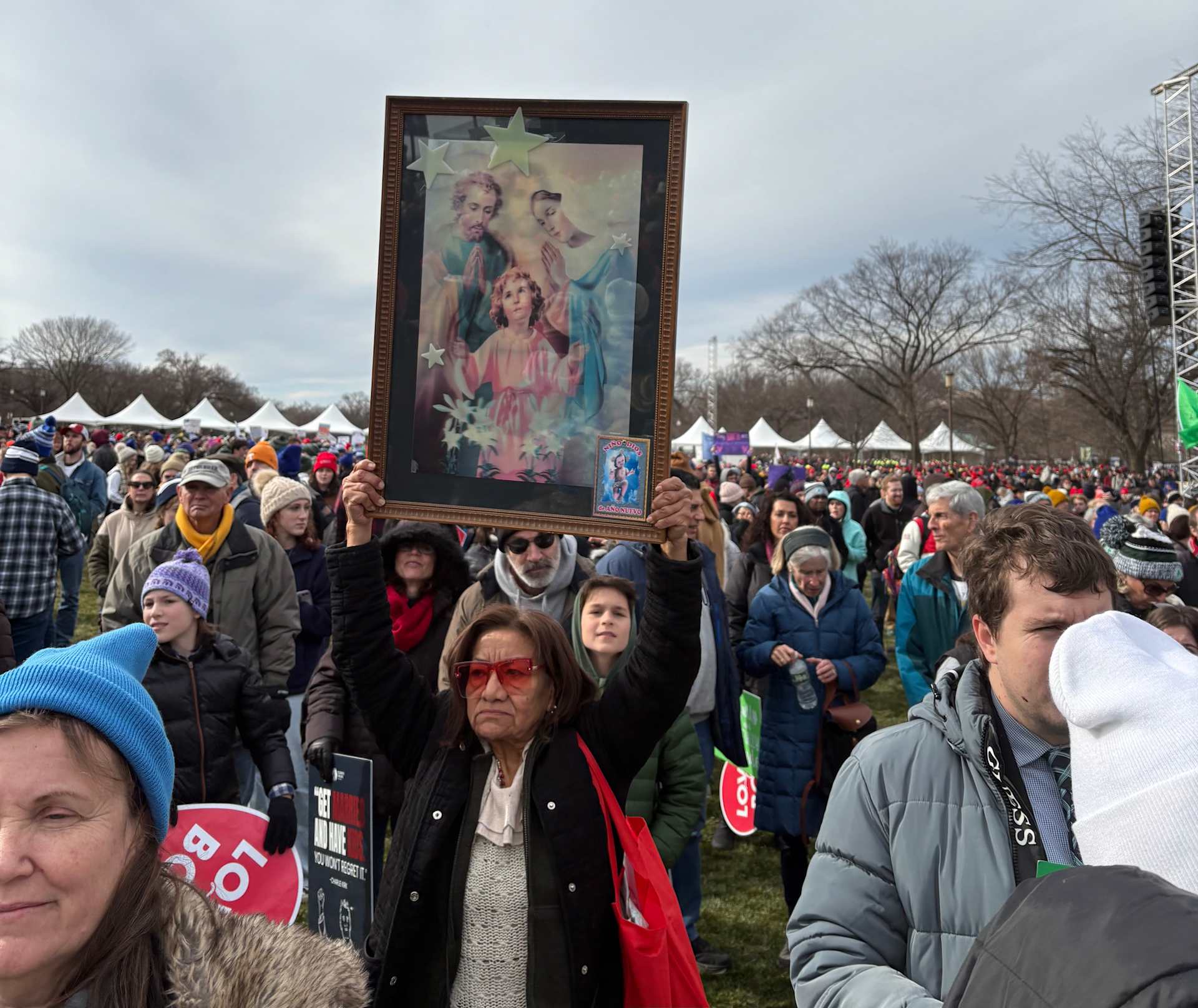 A woman holds a framed portrait of the Holy Family at the March for Life on Jan. 23, 2026. | Credit: Tessa Gervasini/EWTN News