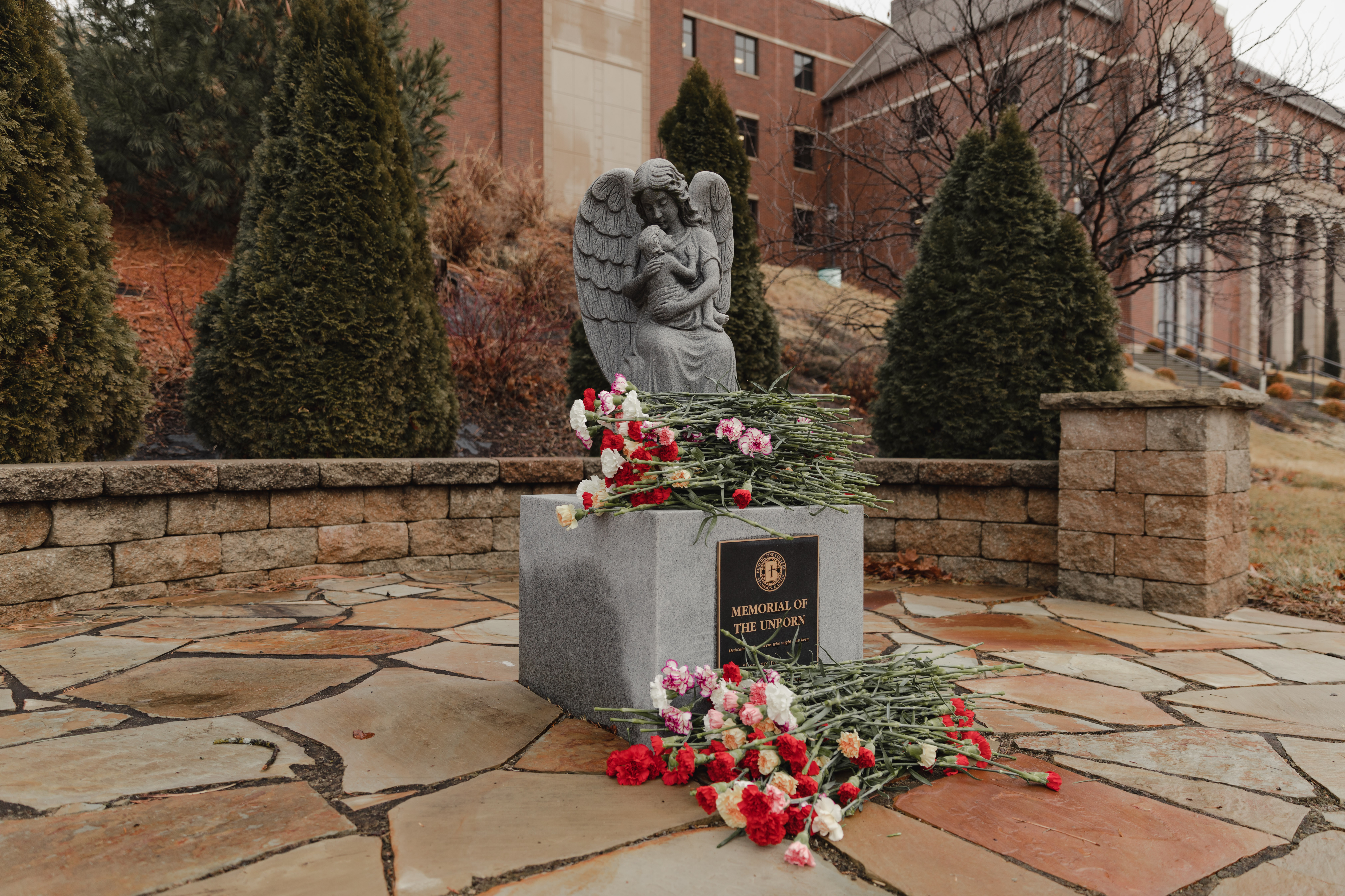 Before Benedictine College students head off to the March for Life in Washington, D.C., they place roses on the campus memorial for unborn children. | Credit: Isabella Wilcox/Benedictine College