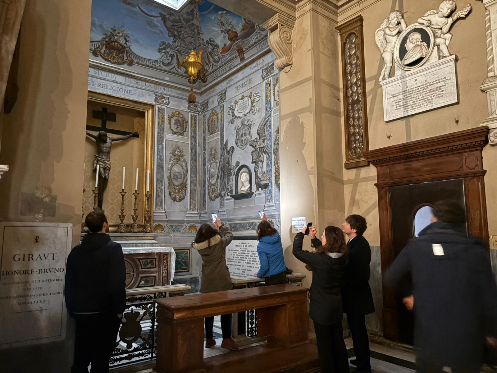 Curious onlookers photograph the fresco of the angel that bore a striking resemblance to Italian Prime Minister Giorgia Meloni&rsquo;s face. | Credit: Victoria Cardiel/EWTN News