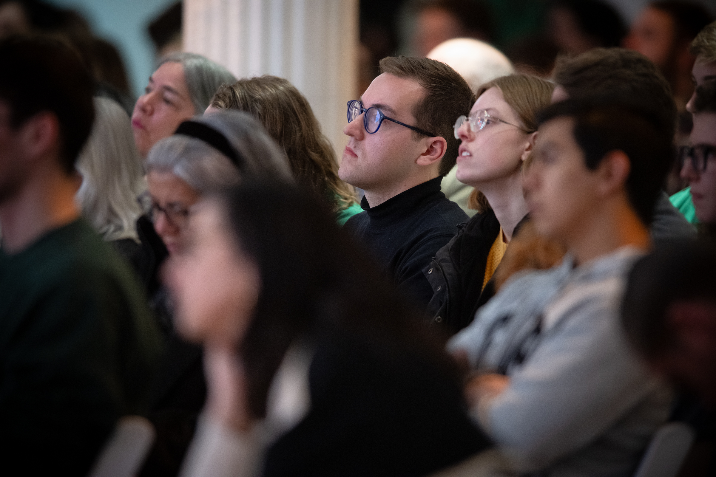Attendees listen to the panel