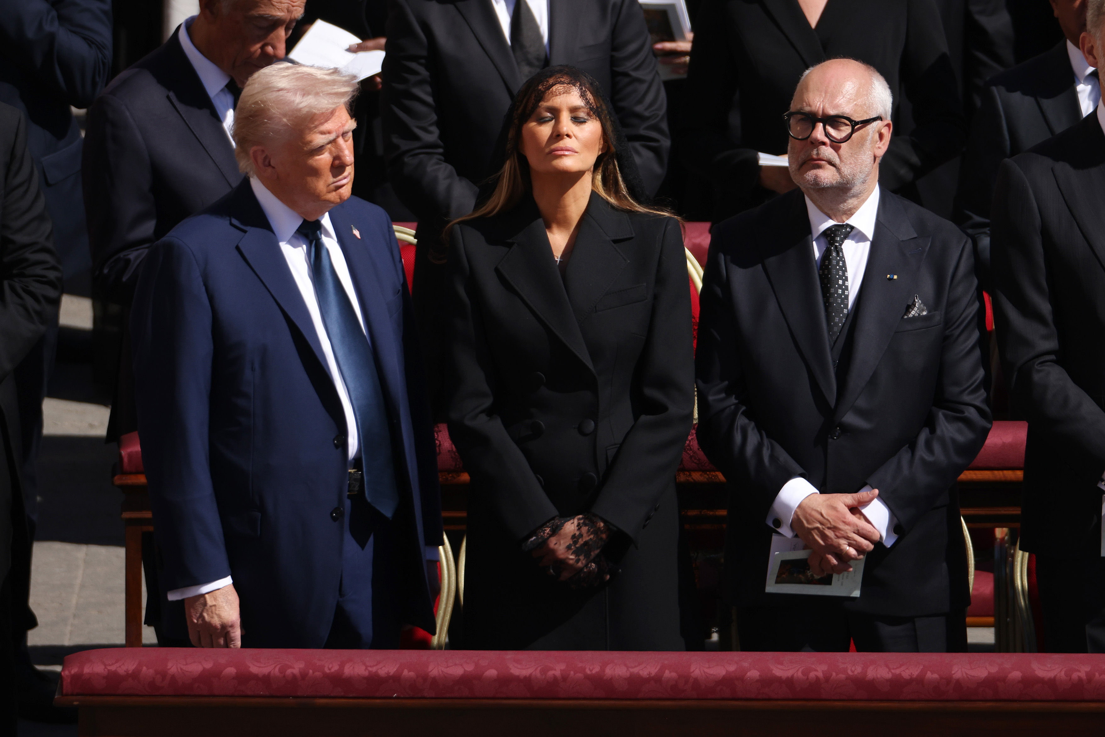 U.S. First Lady Melania Trump, flanked by her husband, President Donald Trump, and Estonian President Alar Karis, at the funeral of Pope Francis in St. Peter&rsquo;s Square on April 26, 2025, in Vatican City. | Credit: Dan Kitwood/Getty Images