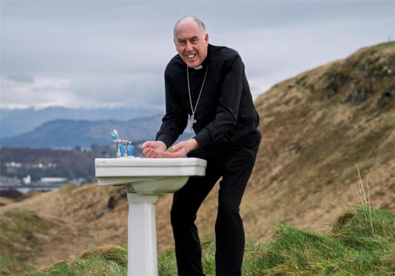 Bishop Brian McGee, bishop president of the Scottish Catholic International Aid Fund (SCIAF), climbed a hill overlooking Oban, Scotland, to bring attention to the annual Lent WEE BOX Appeal 2026, which is raising funding for local organizations in Ethiopia to bring clean water to communities. | Credit: Photo courtesy of SCIAF