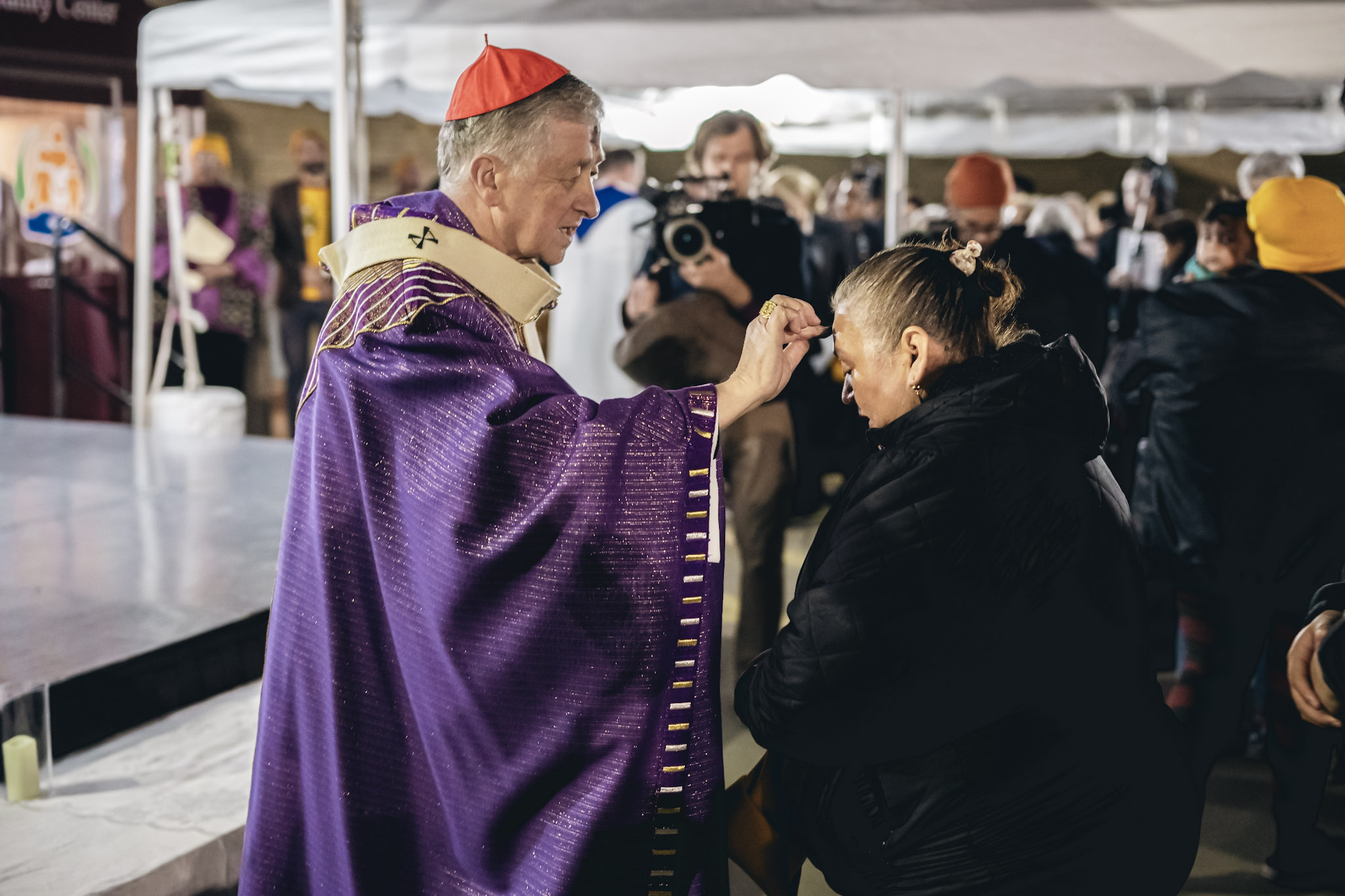Cardinal Blase Cupich, archbishop of Chicago, distributes ashes outside at Our Lady of Mount Carmel Church in Melrose Park, Illinois, in an Ash Wednesday Mass showing solidarity with migrant detainees on Feb. 18, 2026. | Credit: Photo courtesy of the Coalition for Spiritual and Public Leadership (CSPL)