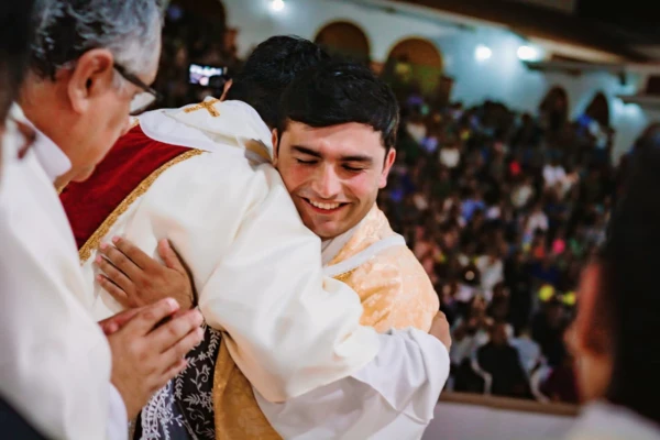 Erlin P&eacute;rez V&aacute;squez is greeted by another priest on the day of his ordination. | Credit: Prelature of Yauyos