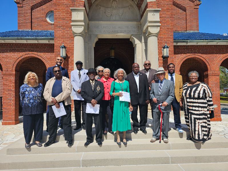 Community members who were present at the campsite in March 1965 pose on the grounds of the City of St. Jude. | Credit: Photo courtesy of the City of St. Jude
