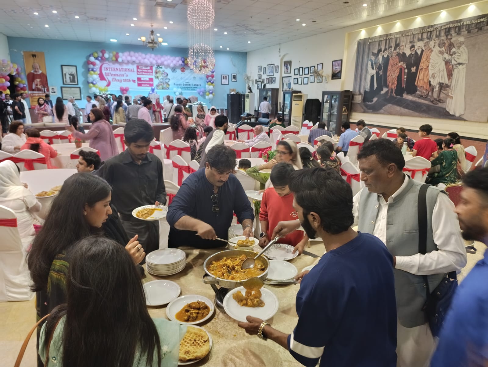 Guests share the interfaith iftar meal at the Dominican Peace Center in Lahore on March 8, 2026. | Credit: Kamran Chaudhry
