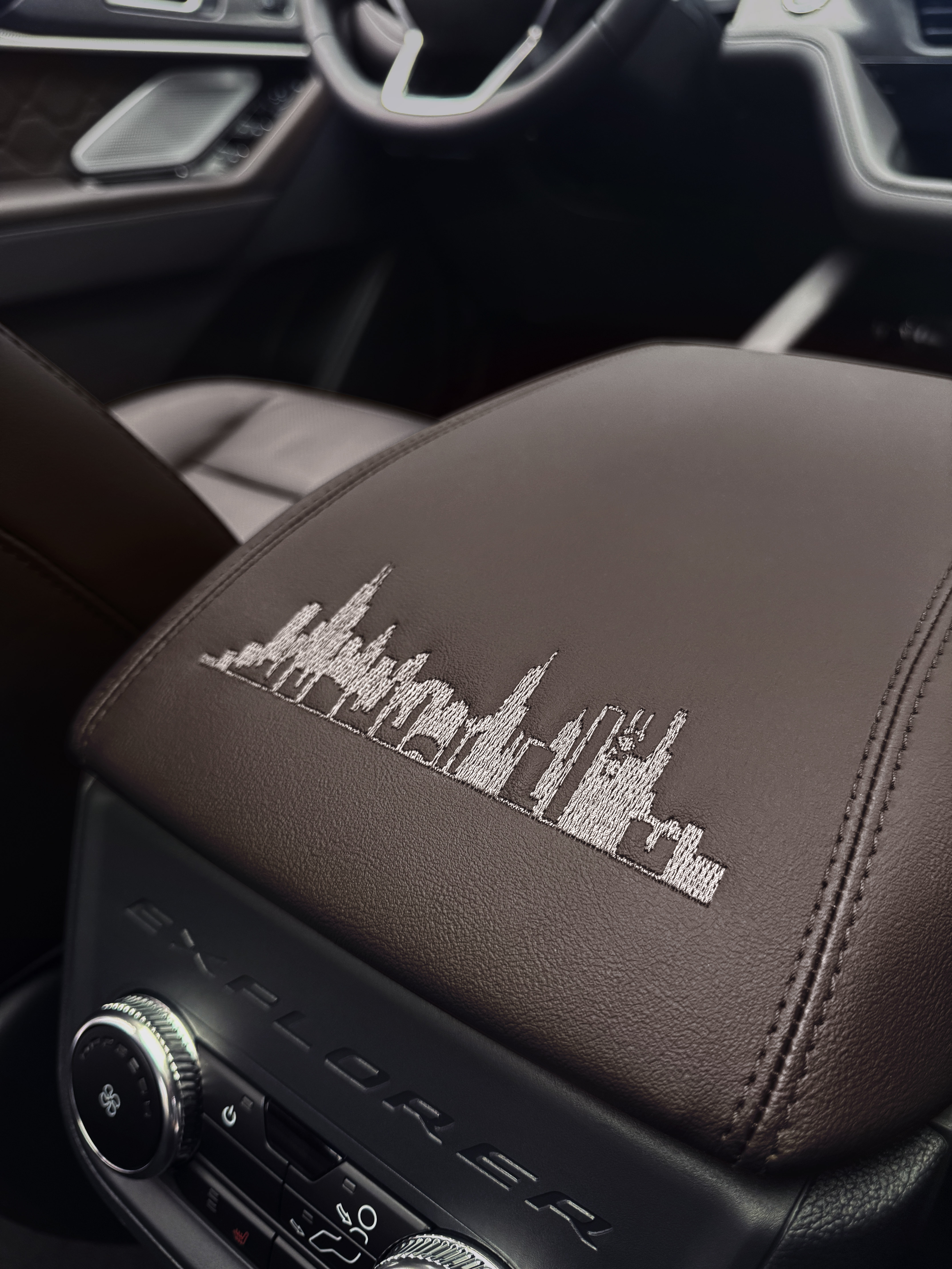 Center console of the custom Ford Explorer built for Pope Leo XIV embroidered with the Chicago skyline. | Credit: Photo courtesy of Ford