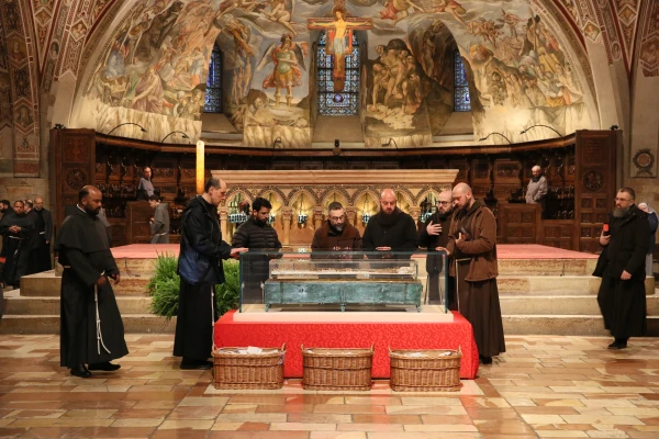 Franciscans pray on March 22, 2026, before the remains of St. Francis of Assisi were returned to the crypt. | Credit: Basilica of St. Francis of Assisi