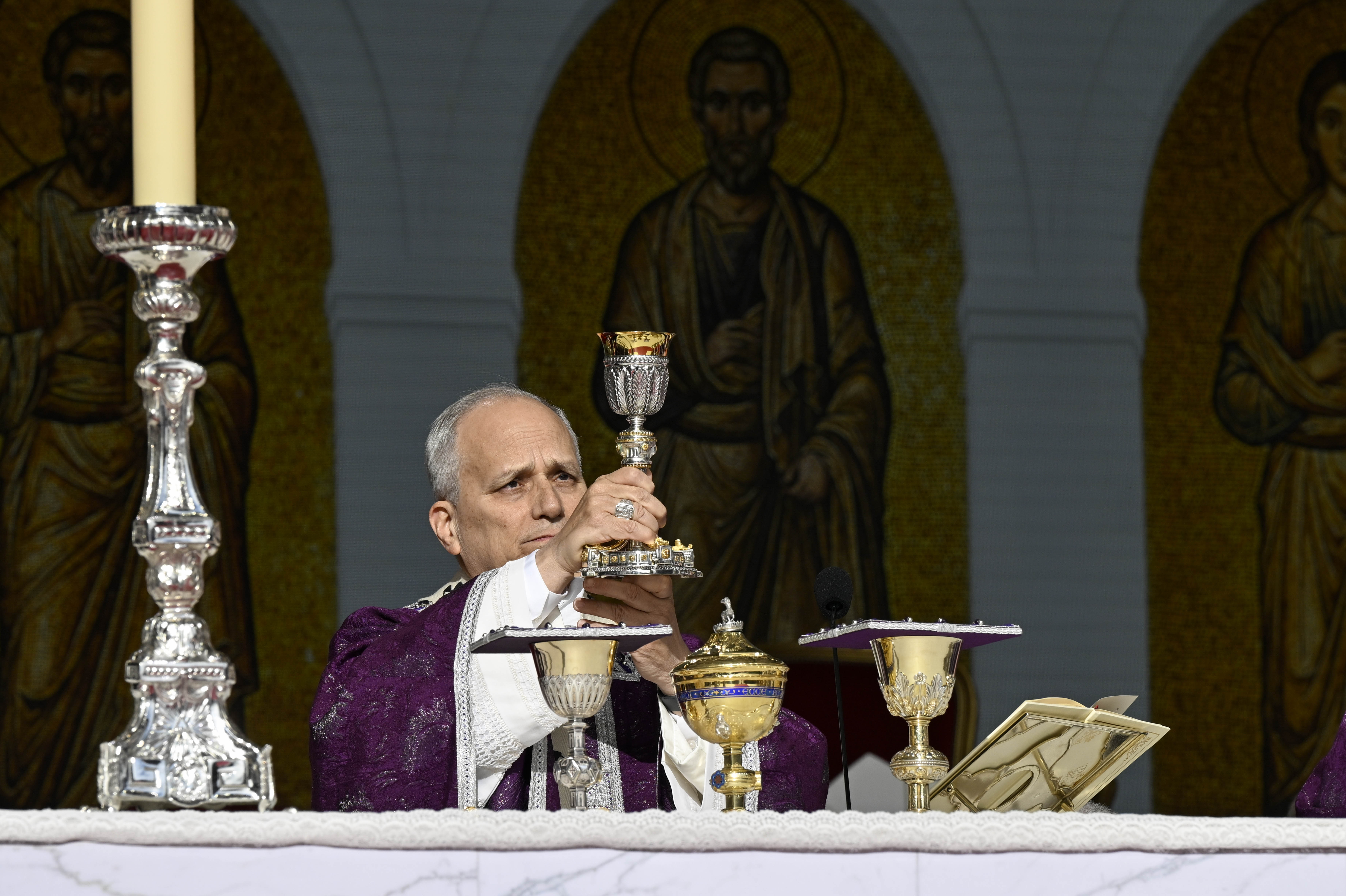 Pope Leo XIV elevates the chalice during Mass at Louis II Stadium in Monaco, Saturday, March 28, 2026 | Credit: Vatican Media