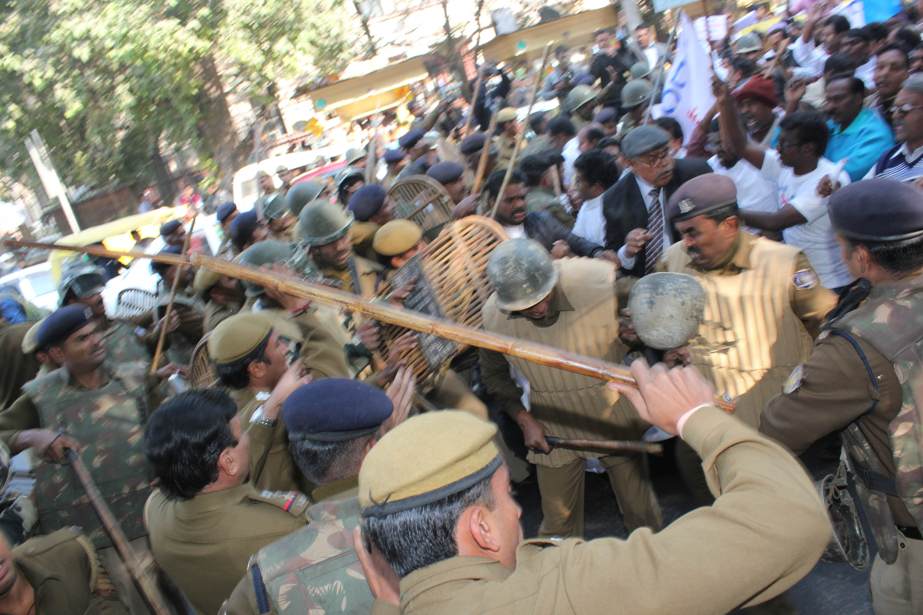Police armed with bamboo batons and cane shields push back Dalit Christian protesters during a march in New Delhi on Dec. 11, 2013. | Credit: Anto Akkara