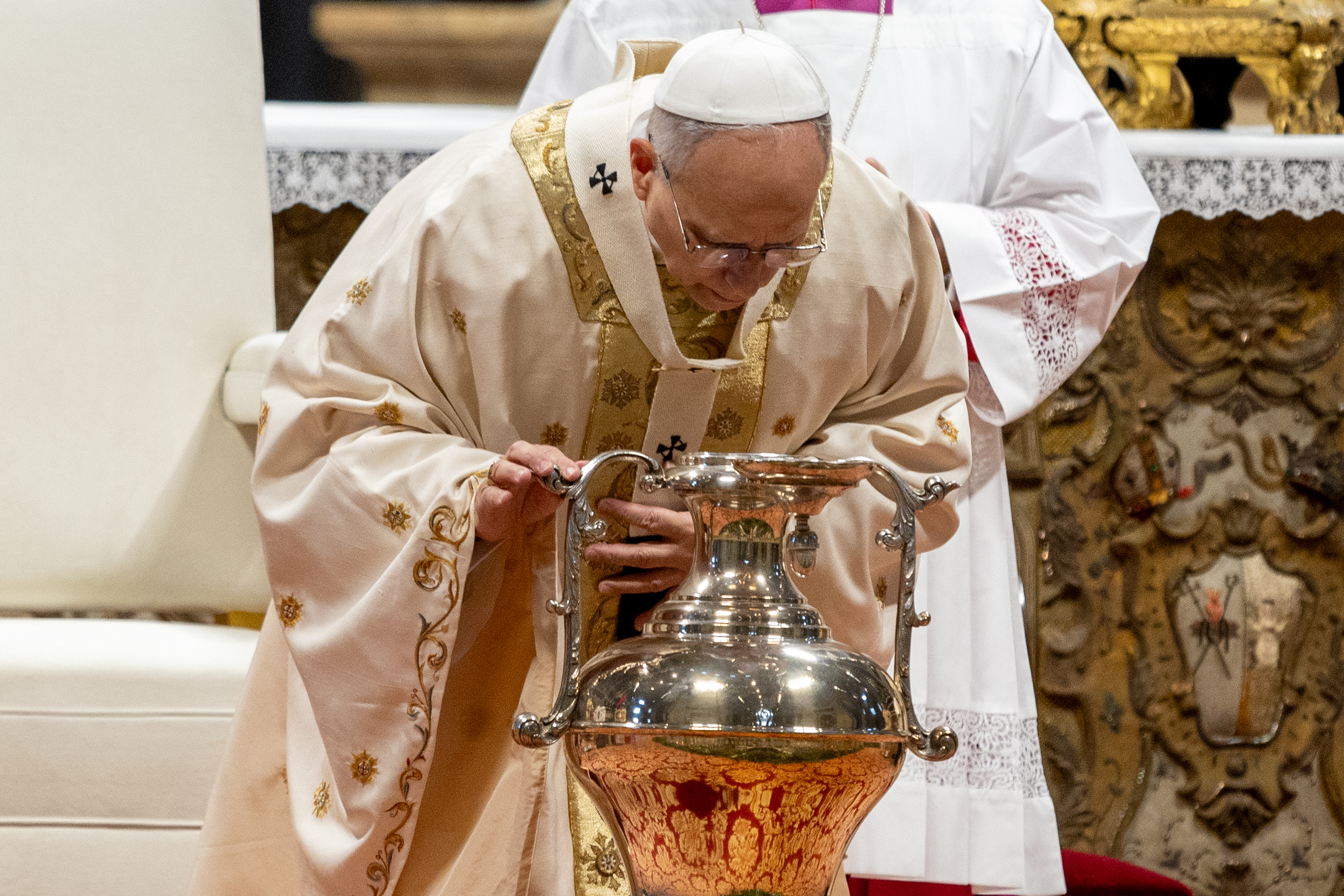 Pope Leo XIV breathes over oil during a chrism Mass at the Vatican on Holy Thursday, April 2, 2026. | Credit: Daniel Ib&aacute;&ntilde;ez/EWTN News