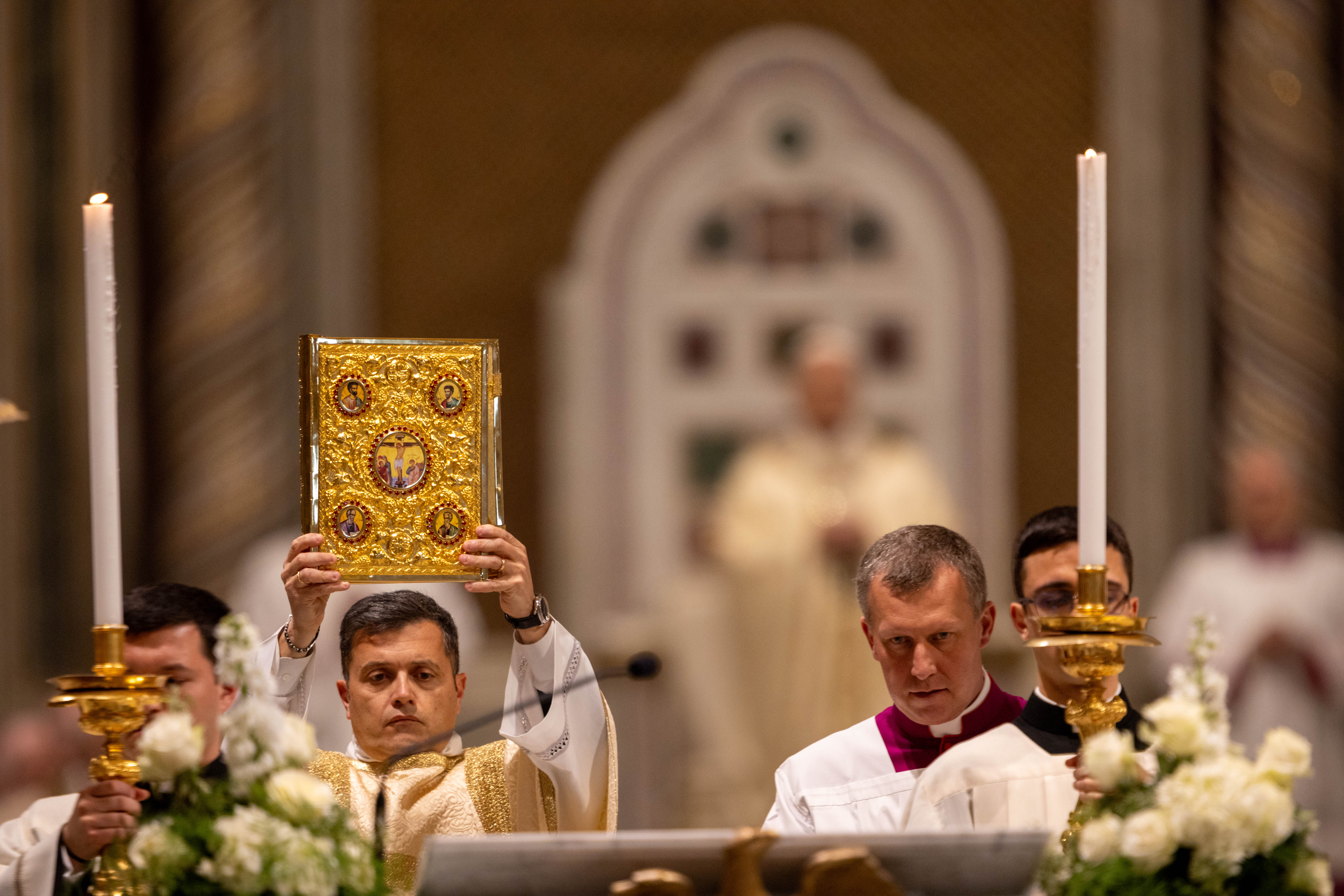 The Gospel is held aloft at the Basilica of St. John Lateran during the Mass of the Lord’s Supper, Thursday, April 2, 2026. | Credit: Daniel Ibáñez/EWTN News