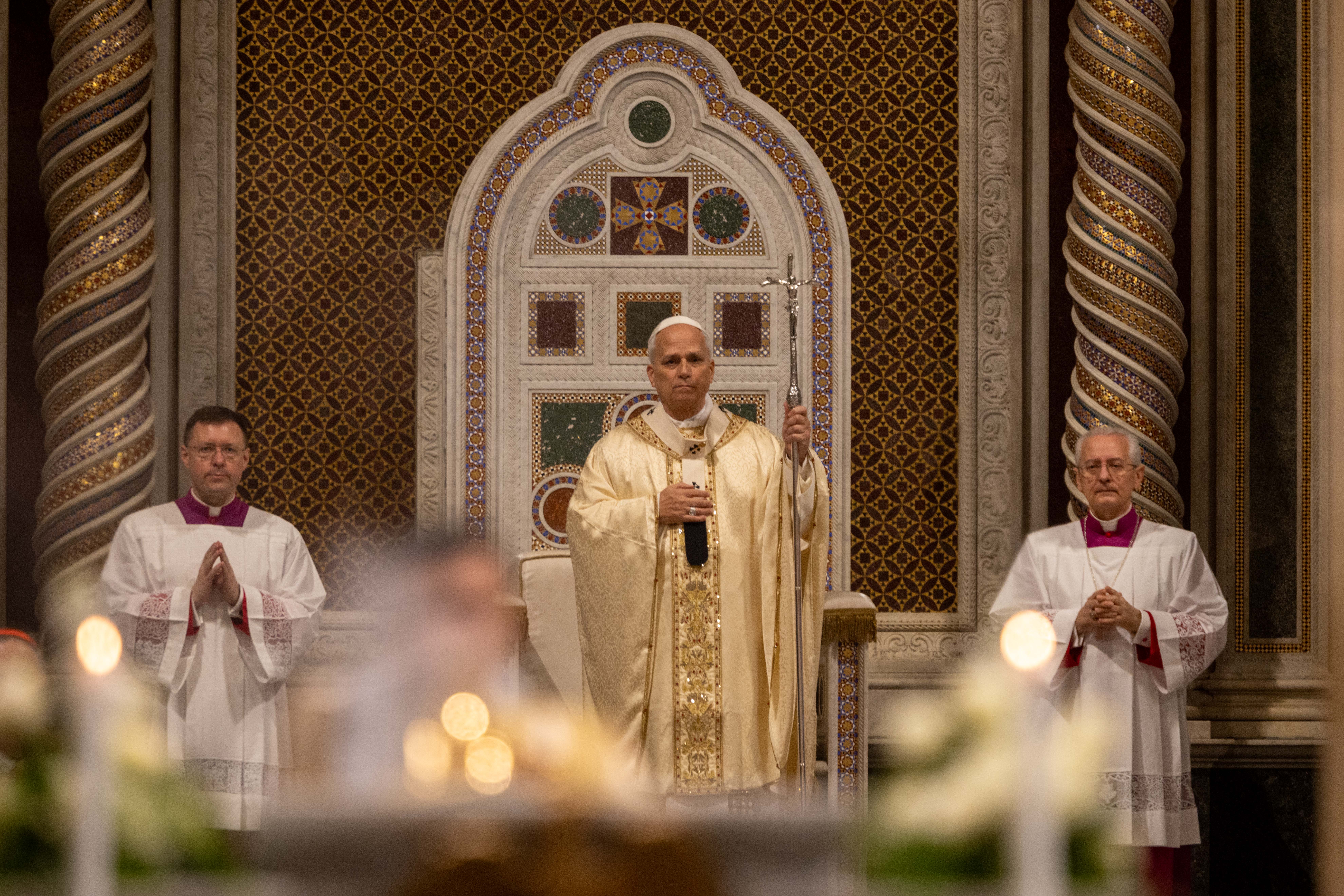 Pope Leo XIV holds a crucifix aloft at the Basilica of St. John Lateran during the Mass of the Lord’s Supper, Thursday, April 2, 2026. | Credit: Daniel Ibáñez/EWTN News