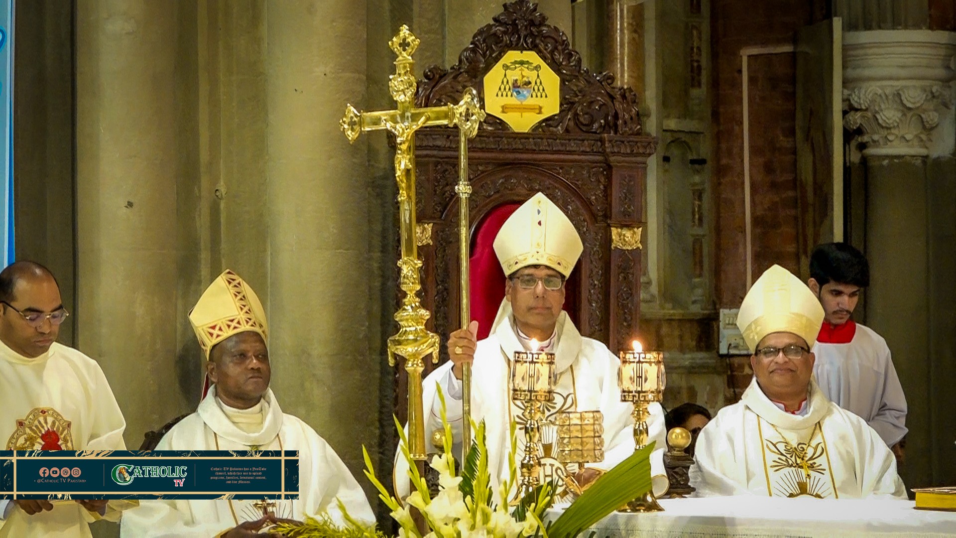 Archbishop Khalid Rehmat of Lahore sits with Archbishop Germano Penemote (left) and Archbishop Benny Mario Travas of Karachi (right) during the installation Mass at Sacred Heart Cathedral in Lahore, Pakistan, on March 28, 2026. | Credit: Photo courtesy of Jasber Ashiq, director of Catholic TV Pakistan