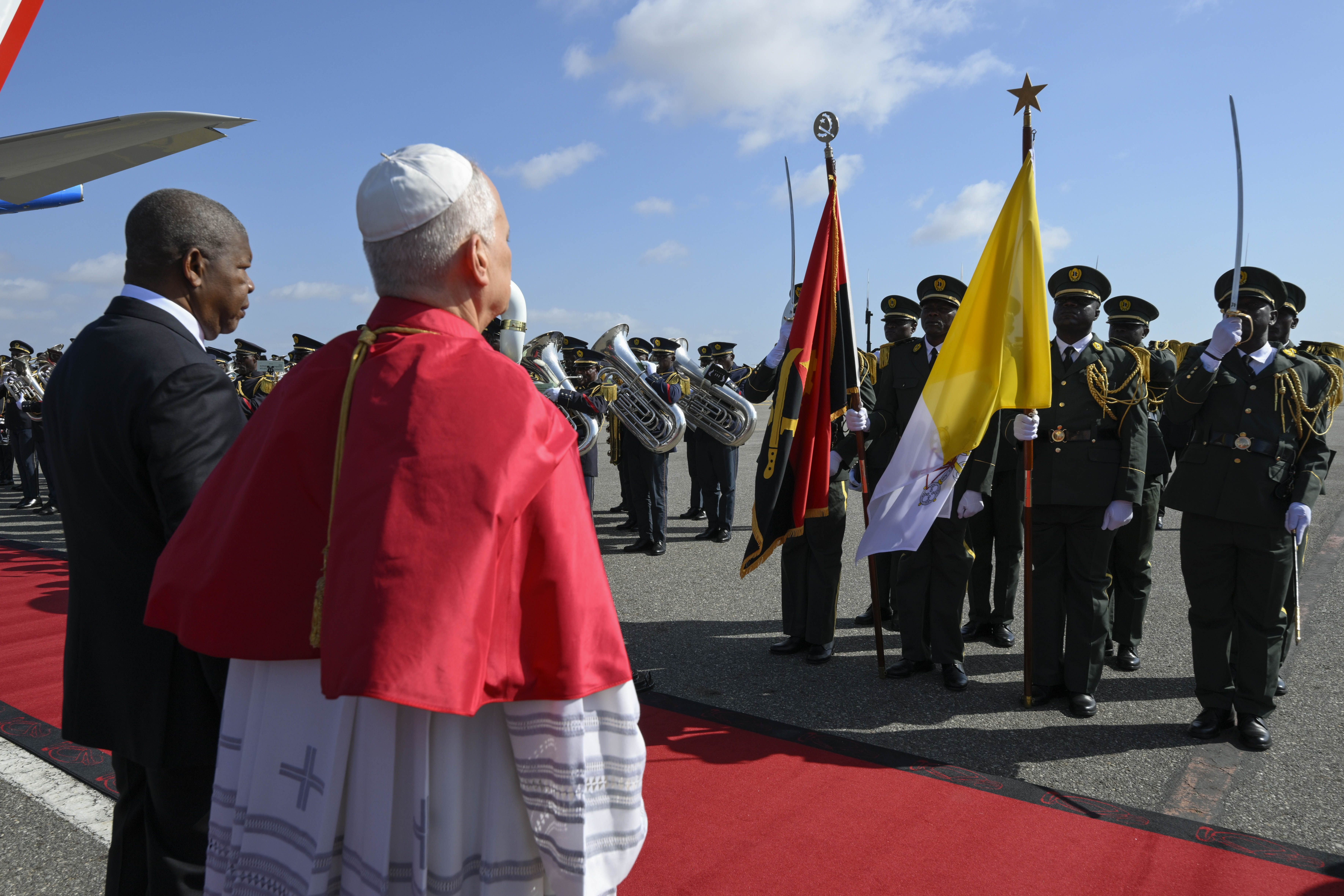 Pope Leo XIV receives a ceremonial greeting upon his arrival at Quatro de Fevereiro Airport in Luanda, Angola, Saturday, April 18, 2026. | Credit: Vatican Media