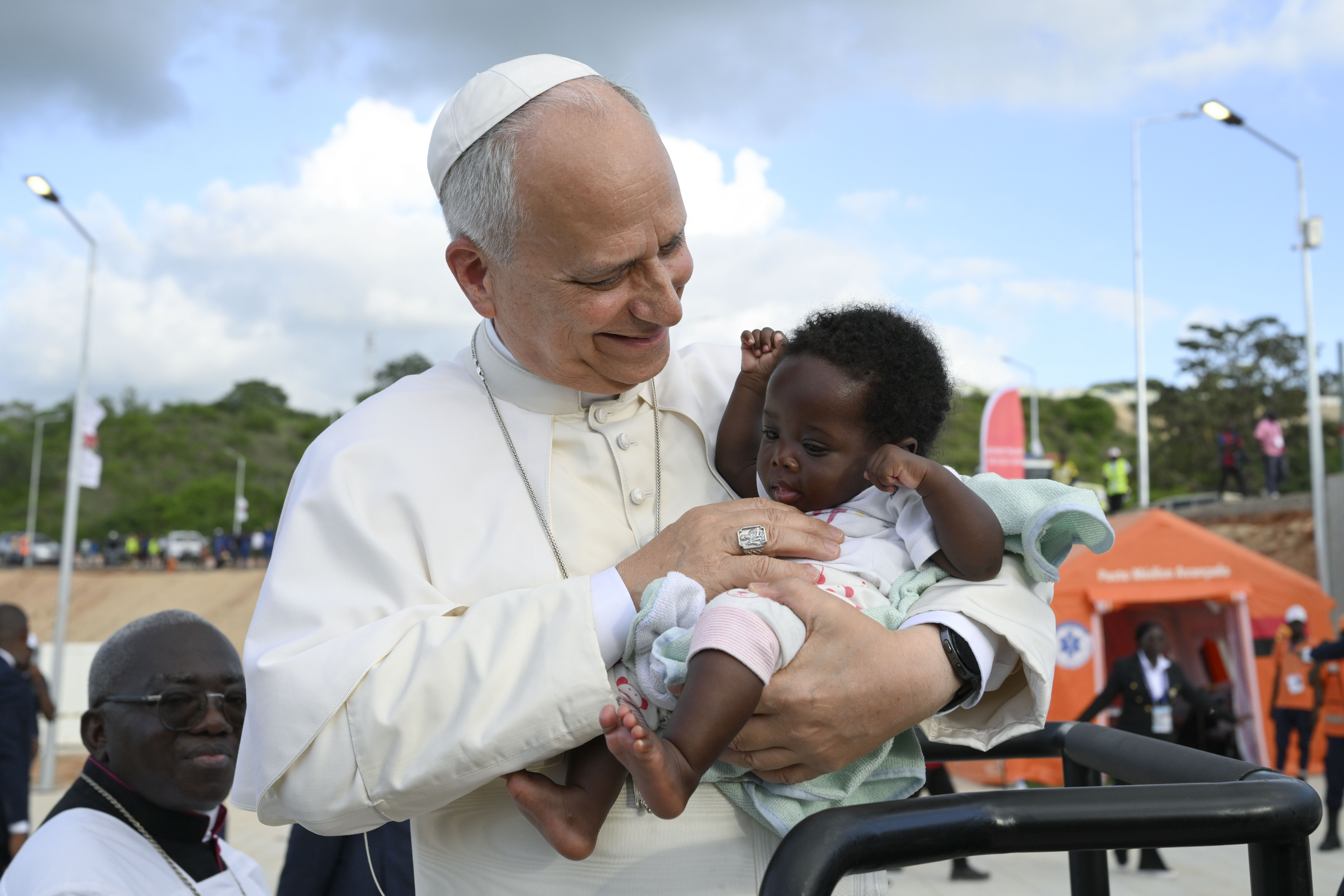 Pope Leo XIV greets a baby during his visit to the Marian shrine of Mama Muxima in Kimbaxe, Angola, on April 19, 2026. | Credit: Vatican Media