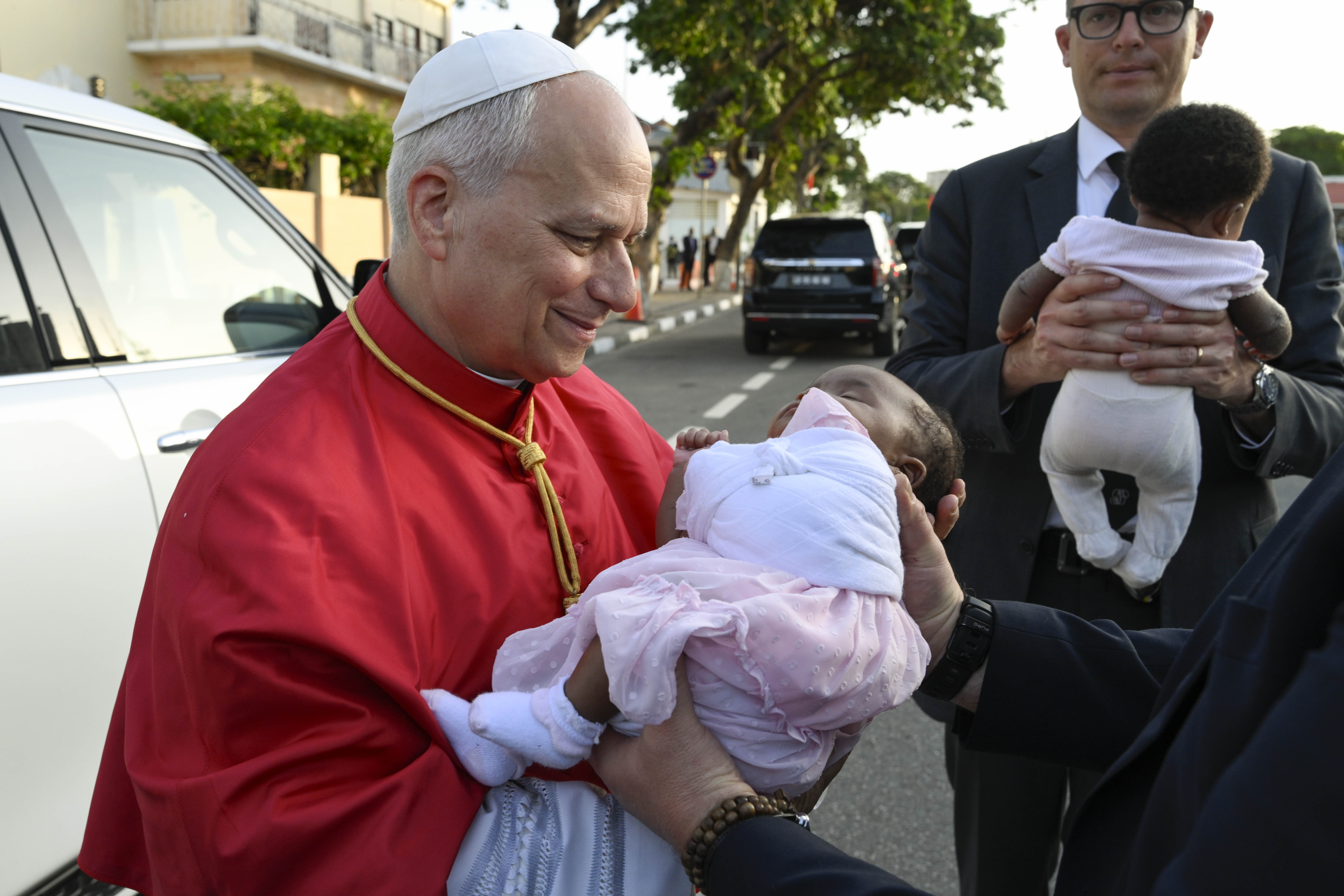 Pope Leo XIV holds a baby during his visit to the apostolic nunciature in Angola on April 20, 2026. | Credit: Vatican Media