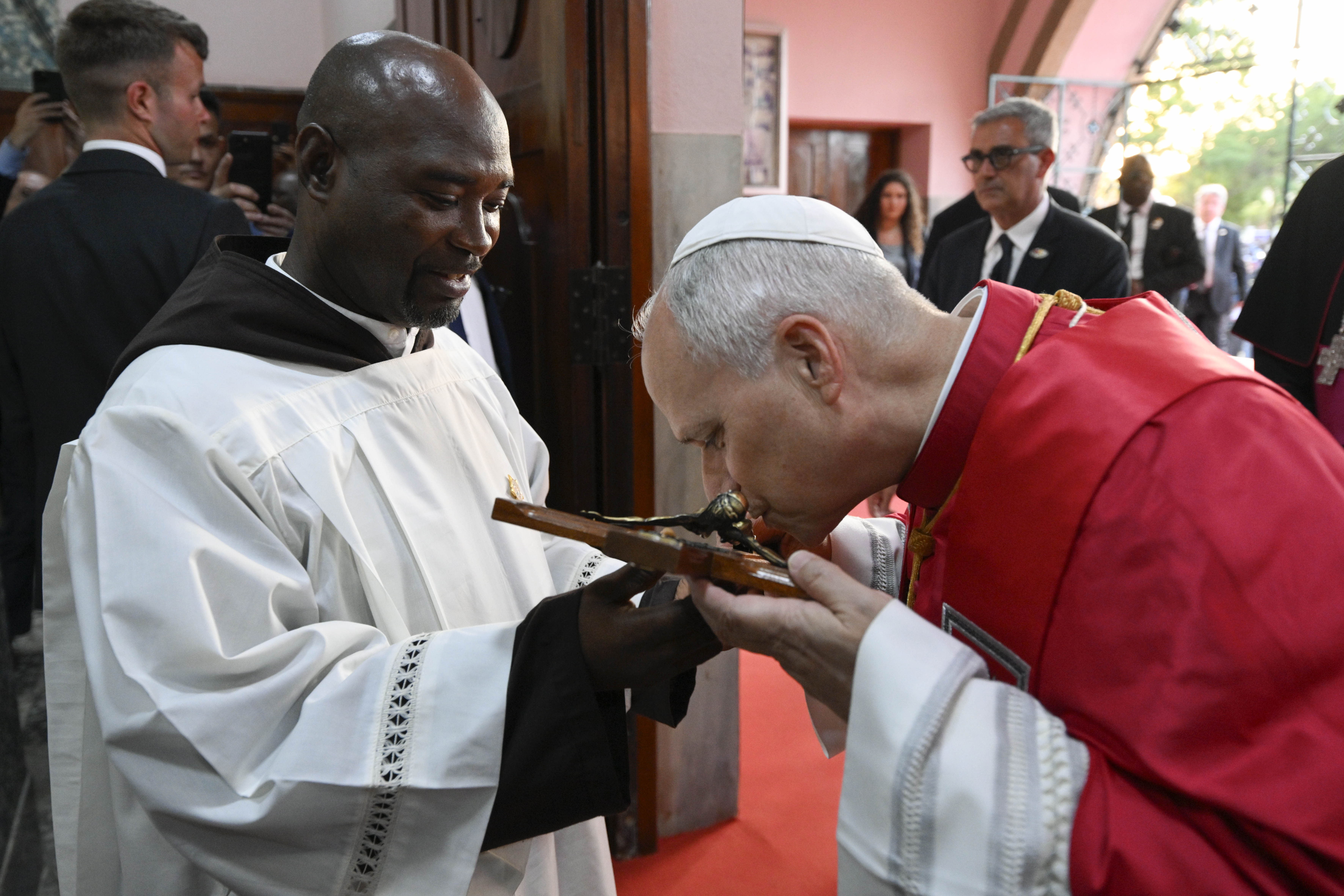 Pope Leo XIV venerates a crucifix during a meeting with bishops, priests, consecrated men and women, catechists, and other pastoral workers at the Parish of Our Lady of Fátima in Luanda, Angola, on April 20, 2026. | Credit: Vatican Media