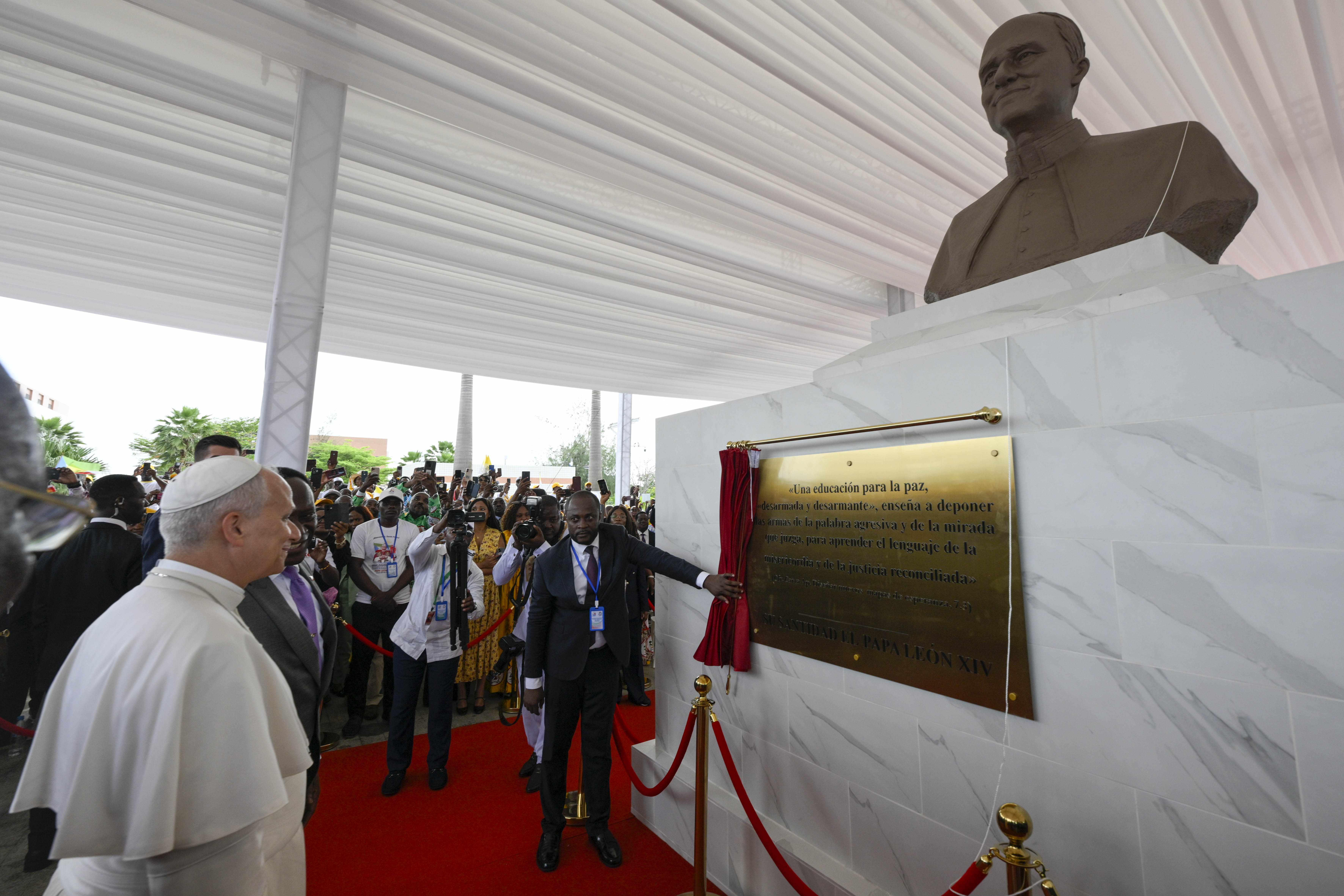 Pope Leo XIV views a plaque underneath a statue in his honor during a meeting with the World of Culture at the León XIV Campus of the National University in Malabo, Equatorial Guinea, on Tuesday, April 21, 2026. | Credit: Vatican Media