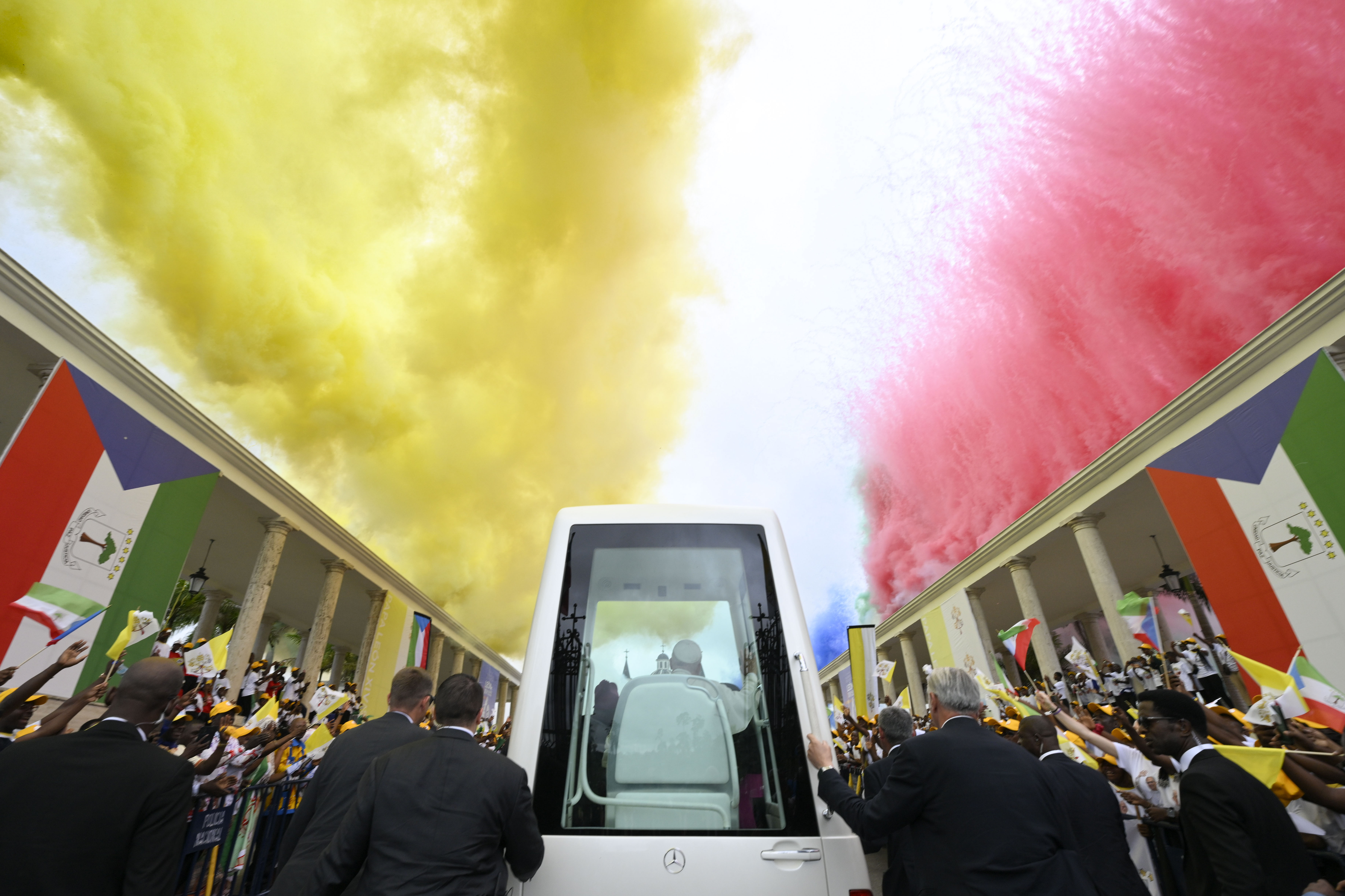 Colorful smoke drifts above Pope Leo XIV at the Basilica of the Immaculate Conception in Mengomeyén, Equatorial Guinea, Wednesday, April 22, 2026. | Credit: Vatican Media