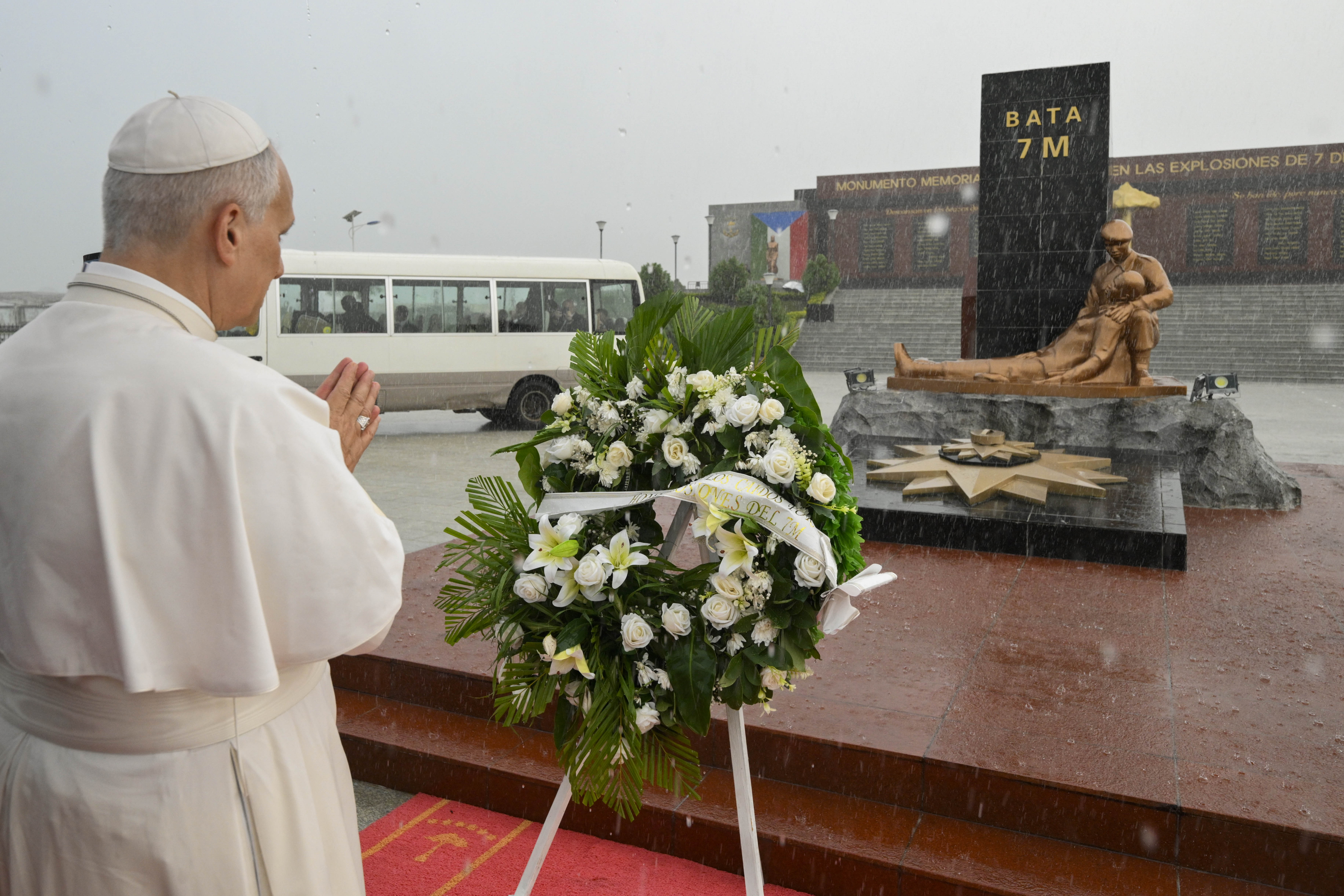 Pope Leo XIV prays at a monument to those who died in the 2021 explosions at Bata, Equatorial Guinea, Wednesday, April 22, 2026. | Credit: Vatican Media