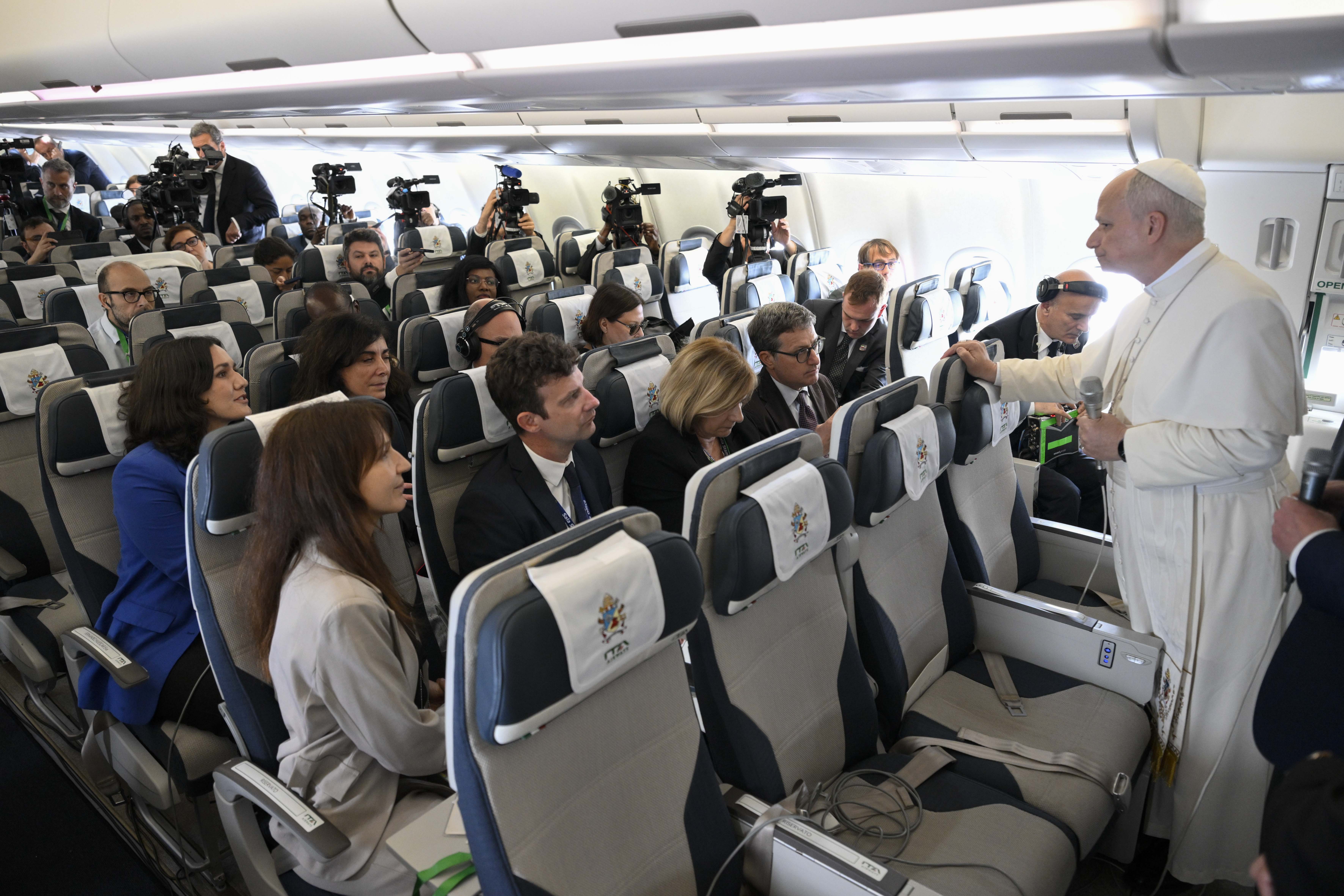 Pope Leo XIV speaks to journalists aboard the papal plane to Rome, Thursday, April 23, 2026. | Credit: Vatican Media