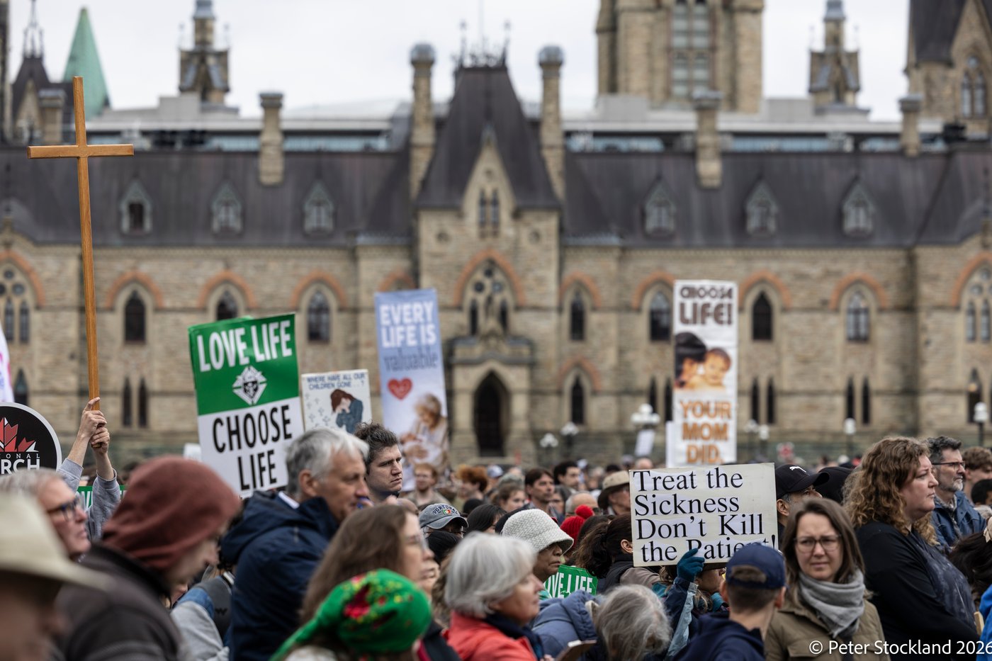 Pro-life signs on Parliament Hill, May 14, 2026, at Canadaʼs March for Life. Organizer Debbie Duval told the crowd “Our legislators are sitting in the House of Commons. We want them to hear us. We want them to know we’re here.” | Credit: Peter Stockland