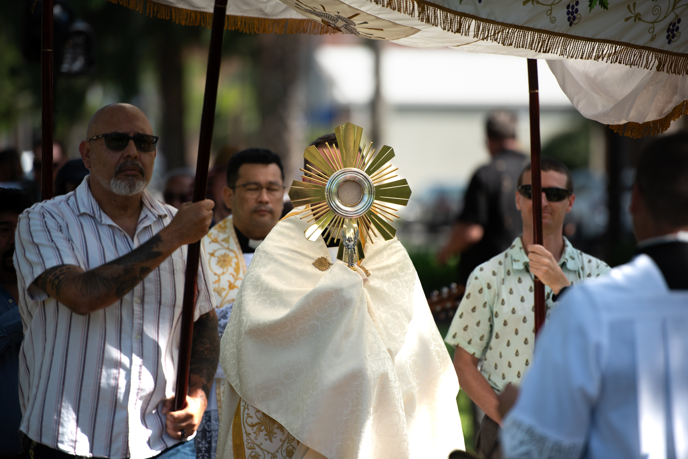 The Blessed Sacrament is carried beneath a canopy during a Eucharistic procession through Hanover Square on May 26, 2026, in Brunswick, Georgia. | Credit: Jeffrey Bruno