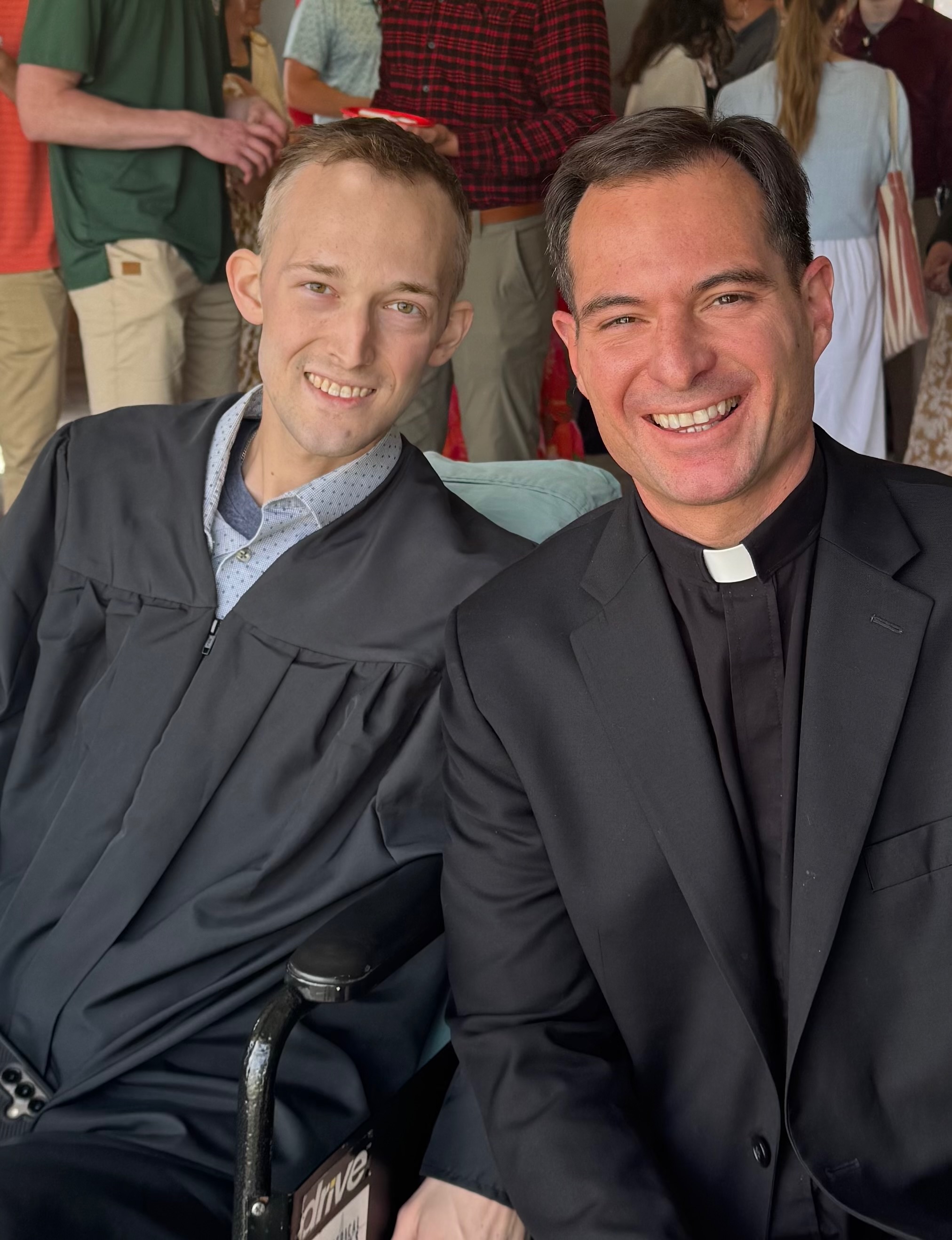Alex Lynch and Father Ryan Richardson at Lynch’s graduation celebration on May 7, 2026. | Credit: Photo courtesy of Father Ryan Richardson