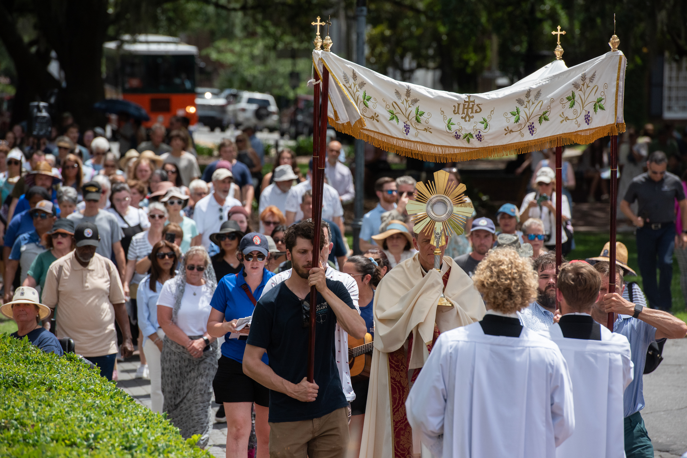 The Blessed Sacrament is carried beneath a canopy during a Eucharistic procession through Savannah’s historic district on May 26, 2026. | Credit: Jeffrey Bruno