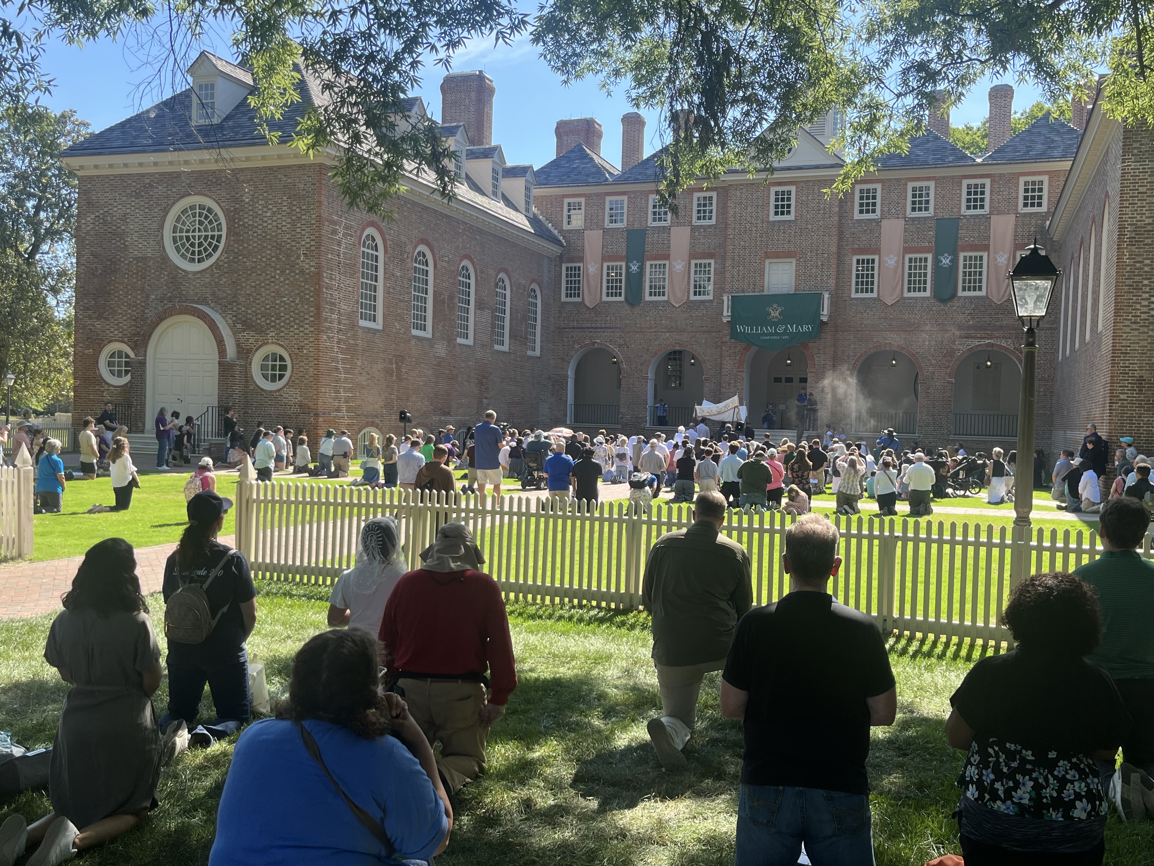 Hundreds of Catholics kneel before the Blessed Sacrament at the Wren Building on the campus of the College of William & Mary, June 5, 2026. | Credit: Daniel Payne/EWTN News