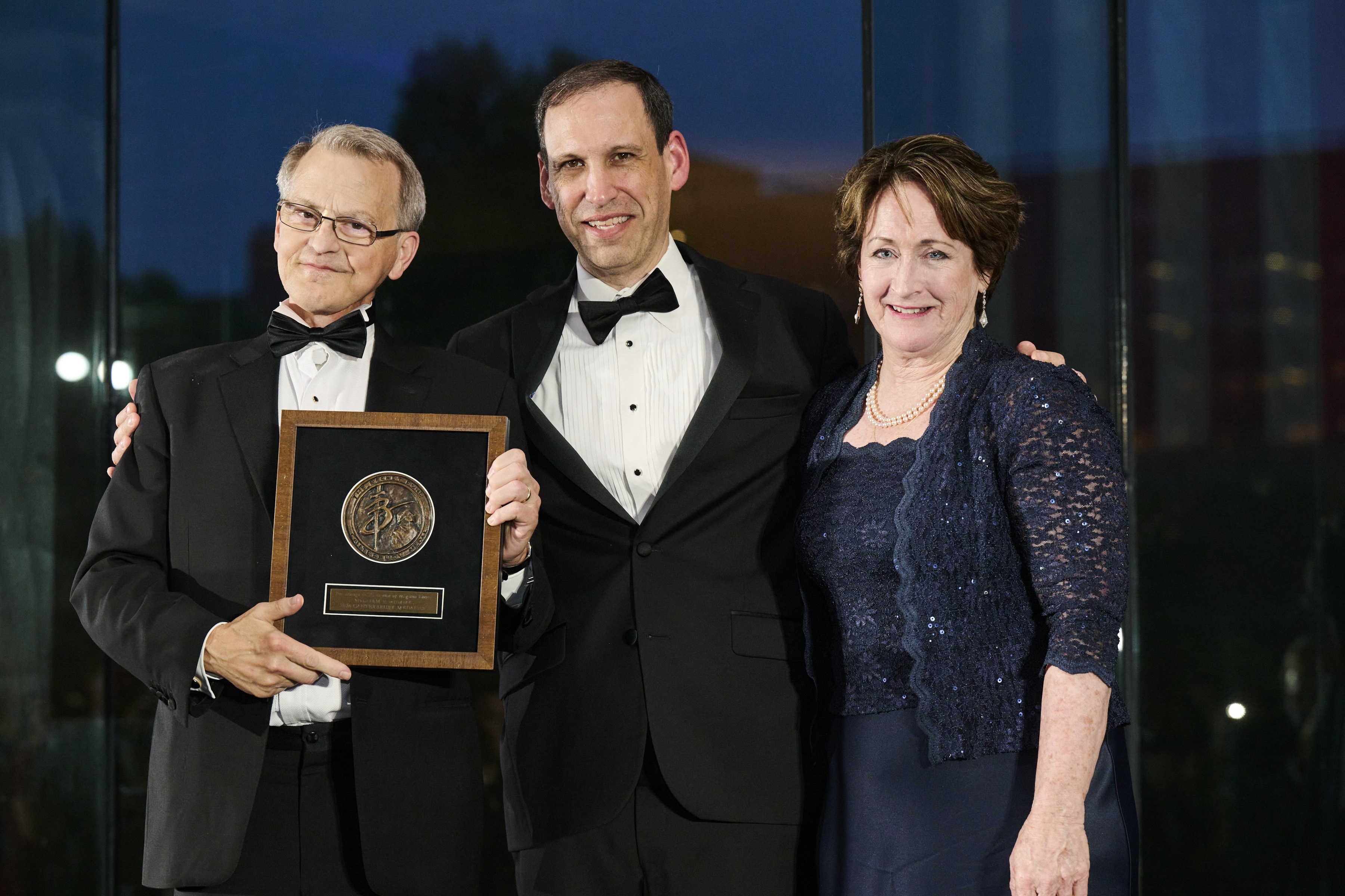 William P. “Bill” Mumma, left, receives the 2026 Canterbury Medal, accompanied by Becket Fund President and CEO Mark Rienzi and Mary Rice Hasson, wife of Becket Fund founder Kevin J. “Seamus” Hasson and a distinguished scholar in her own right at the Ethics and Public Policy Center. | Credit: Courtesy of Becket Fund