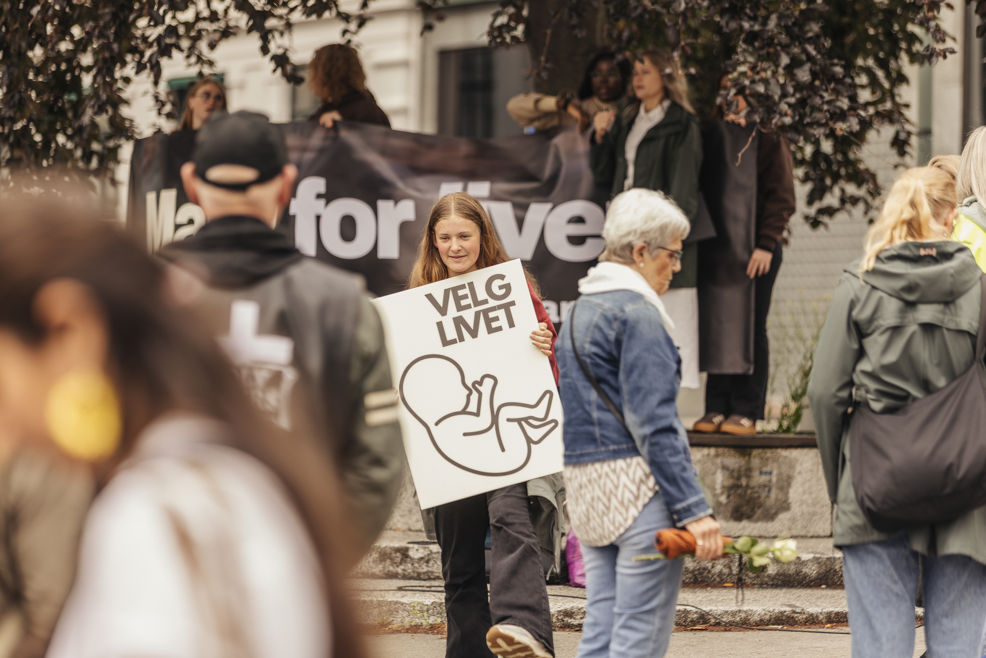 A young participant carries a