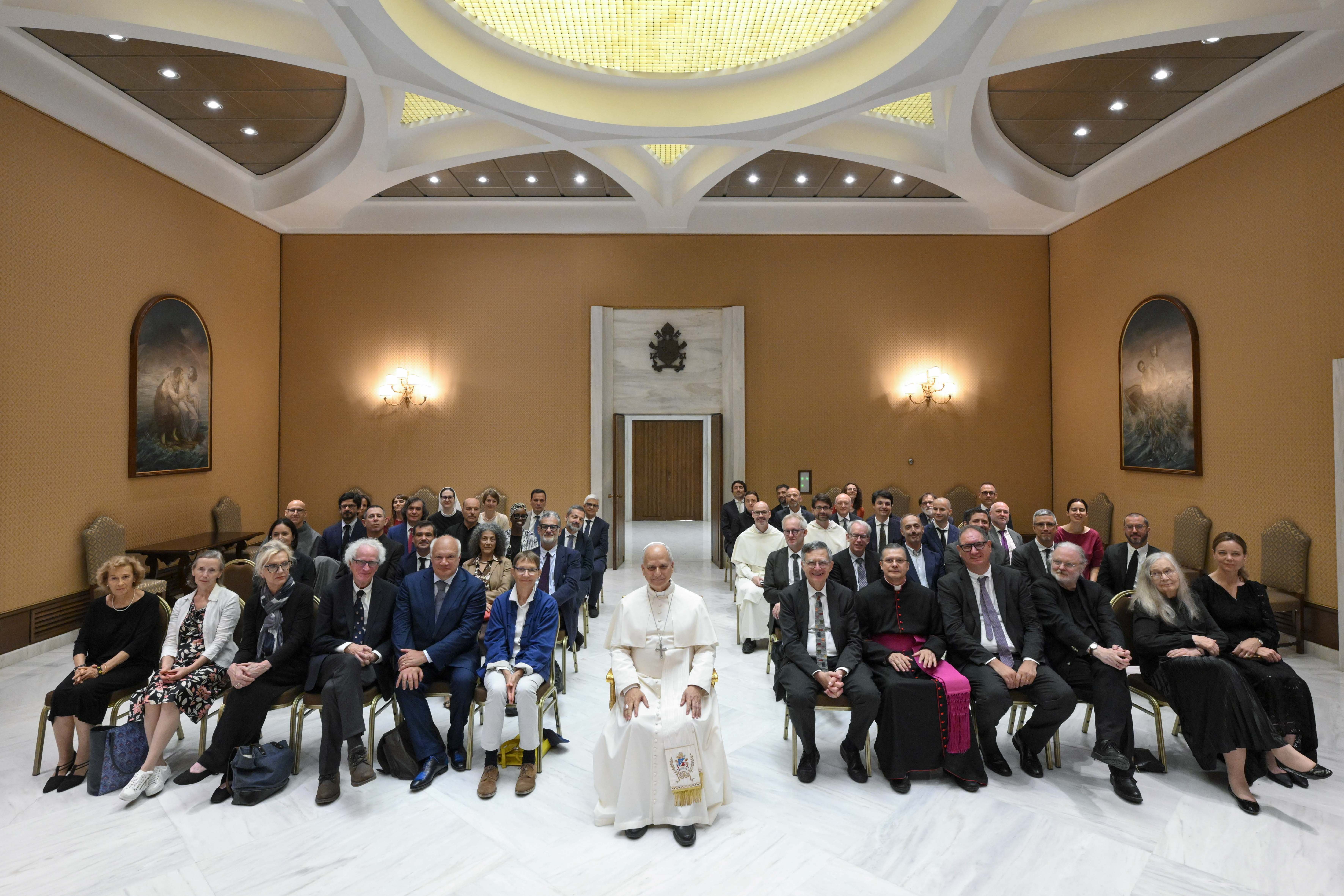 Pope Leo XIV poses for a photo during an audience with 28 writers from around the world, including Americans Marilynne Robinson, Elizabeth Strout, Phil Klay, Jonathan Safran Foer, and Paul Elie, at the Vatican on June 24, 2026. | Credit: Vatican Media