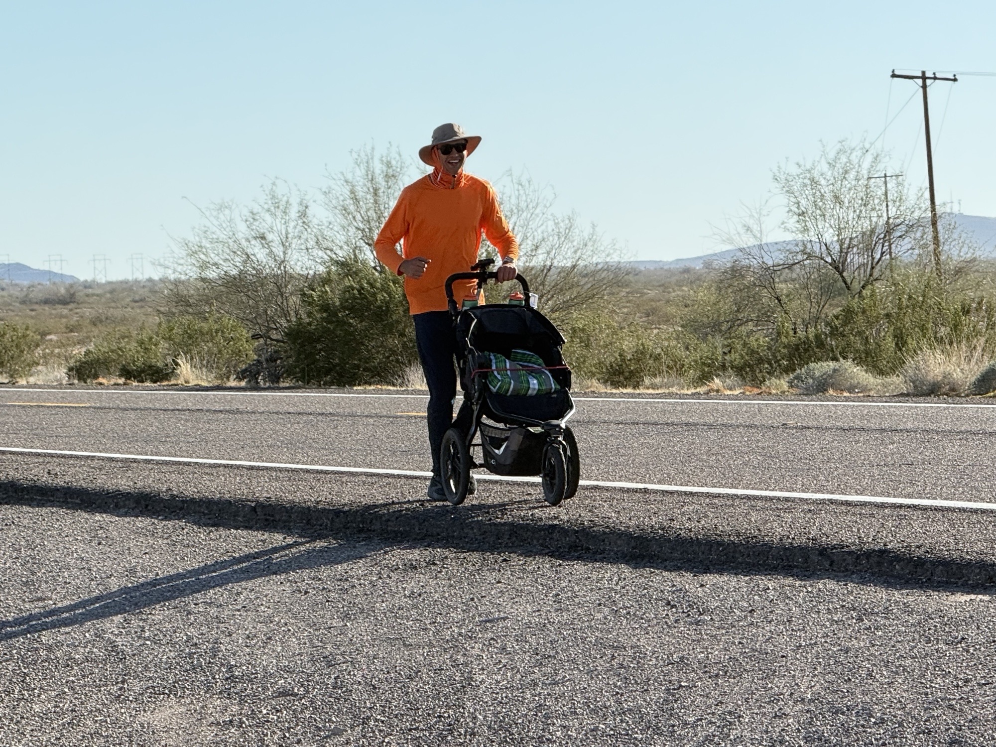 Jared Plasberg runs along a road in the Arizona desert near the Yuma Proving Grounds in February 2026. 