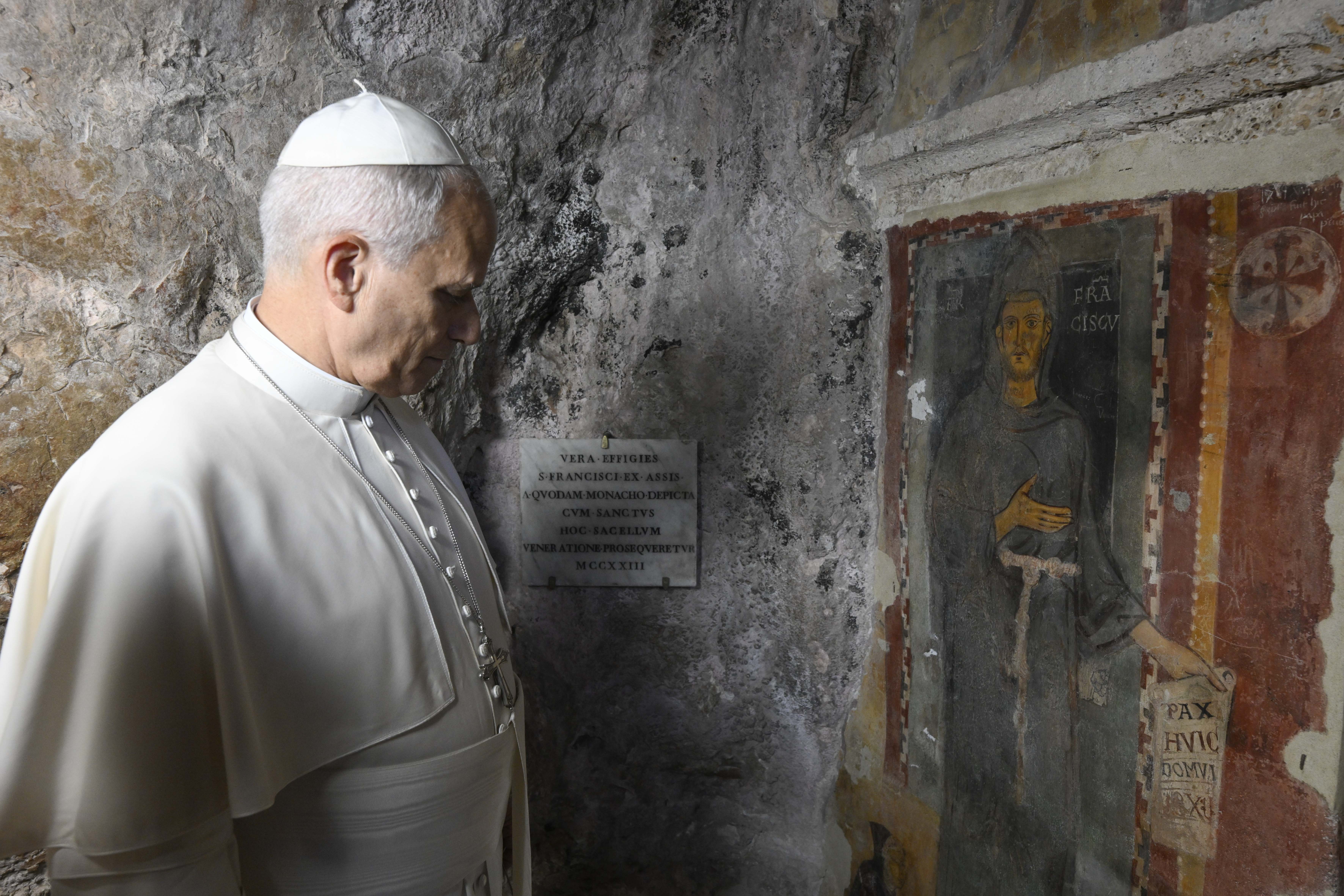 Pope Leo XIV stands before the oldest-known fresco of Saint Francis of Assisi at St. Benedict Abbey in Subiaco, Italy, on July 22, 2026. | Credit: Vatican Media
