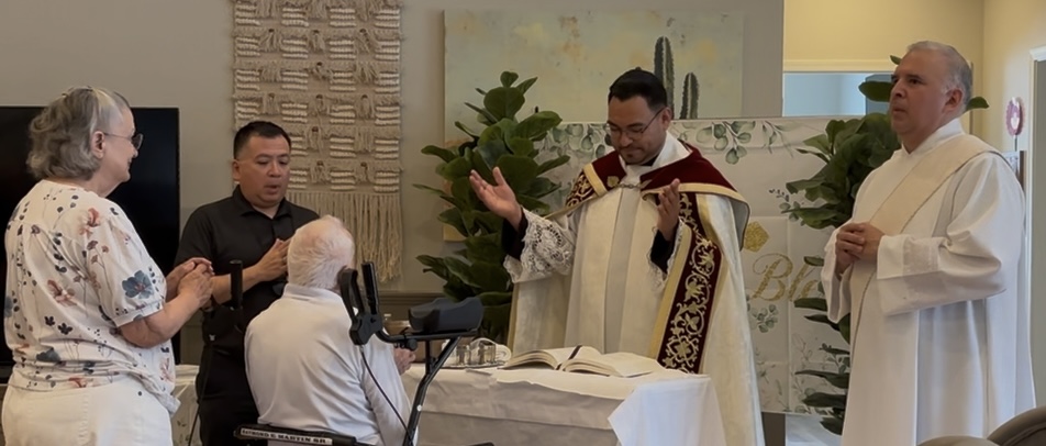 Father Edson Elizarraras, pastor of St. Christopher Parish in Marana, Arizona, celebrates Mass at 98-year-old Raymond Martin's baptism, confirmation, and first Communion on July 16, 2026. | Credit: Photo courtesy of Deacon Jack Trevino