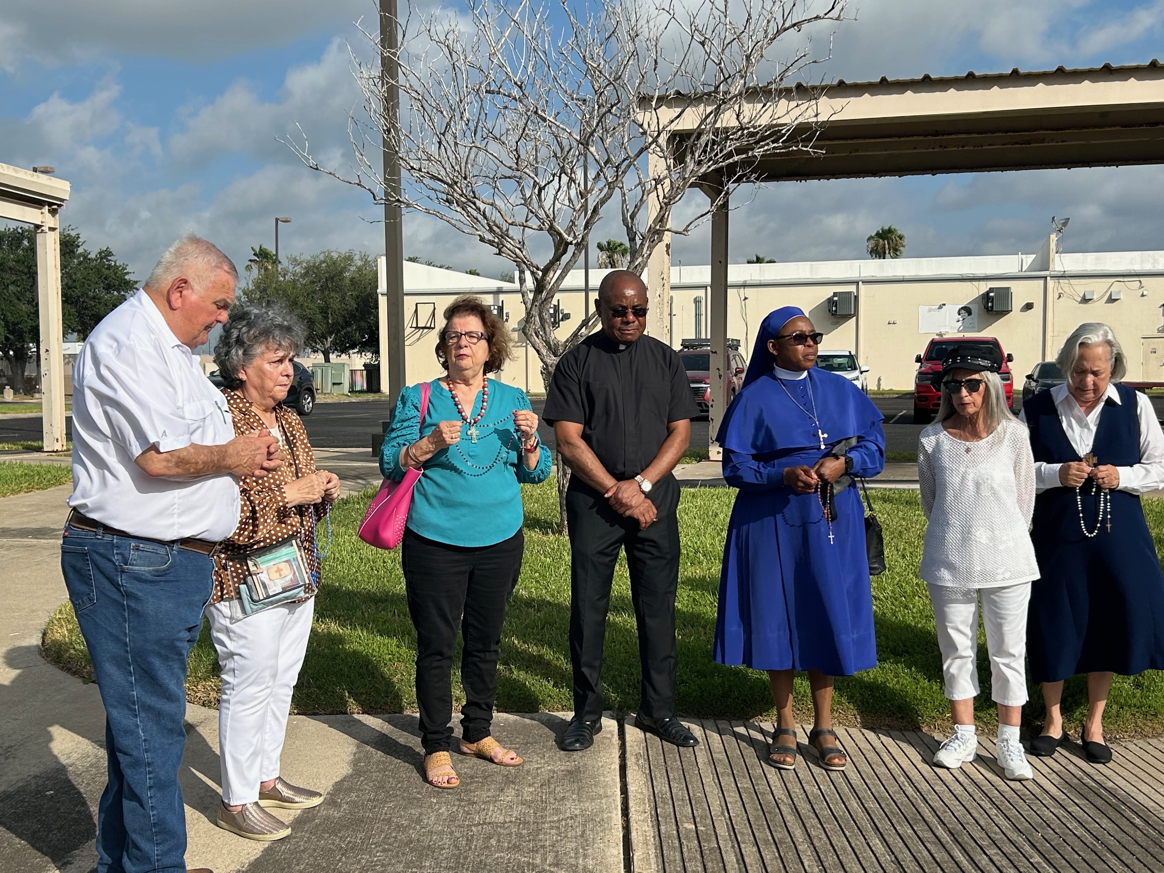 Supporters of Sister Leticia Ugboaja, including Sister Norma Pimentel, right, pray the rosary outside an ICE field office in Harlingen, Texas, as they await news of Ugboaja's immigration case, July 28, 2026. | Credit: Amira Abuzeid/EWTN News