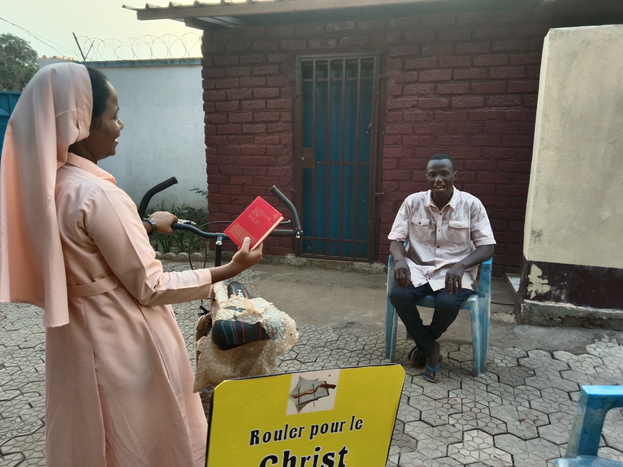 A Marianist sister speaks to a man in the Central African Republic, July 24, 2026. | Credit: Photo courtesy of the U.S. Conference of Catholic Bishops (USCCB)
