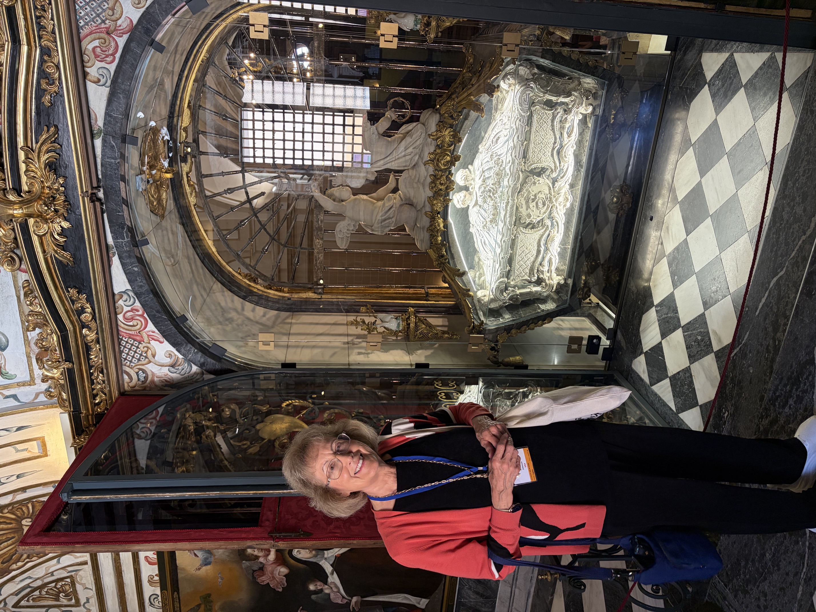 Michelle Johnson stands beside the tomb of St. Teresa of Ávila located at the Carmelite Monastery of the Annunciation in Alba de Tormes, Spain. Along with the tomb of St. John of the Cross in Segovia, this is arguably one of the Carmelite order’s most revered sites. | Credit: Photo courtesy of Michelle Johnson