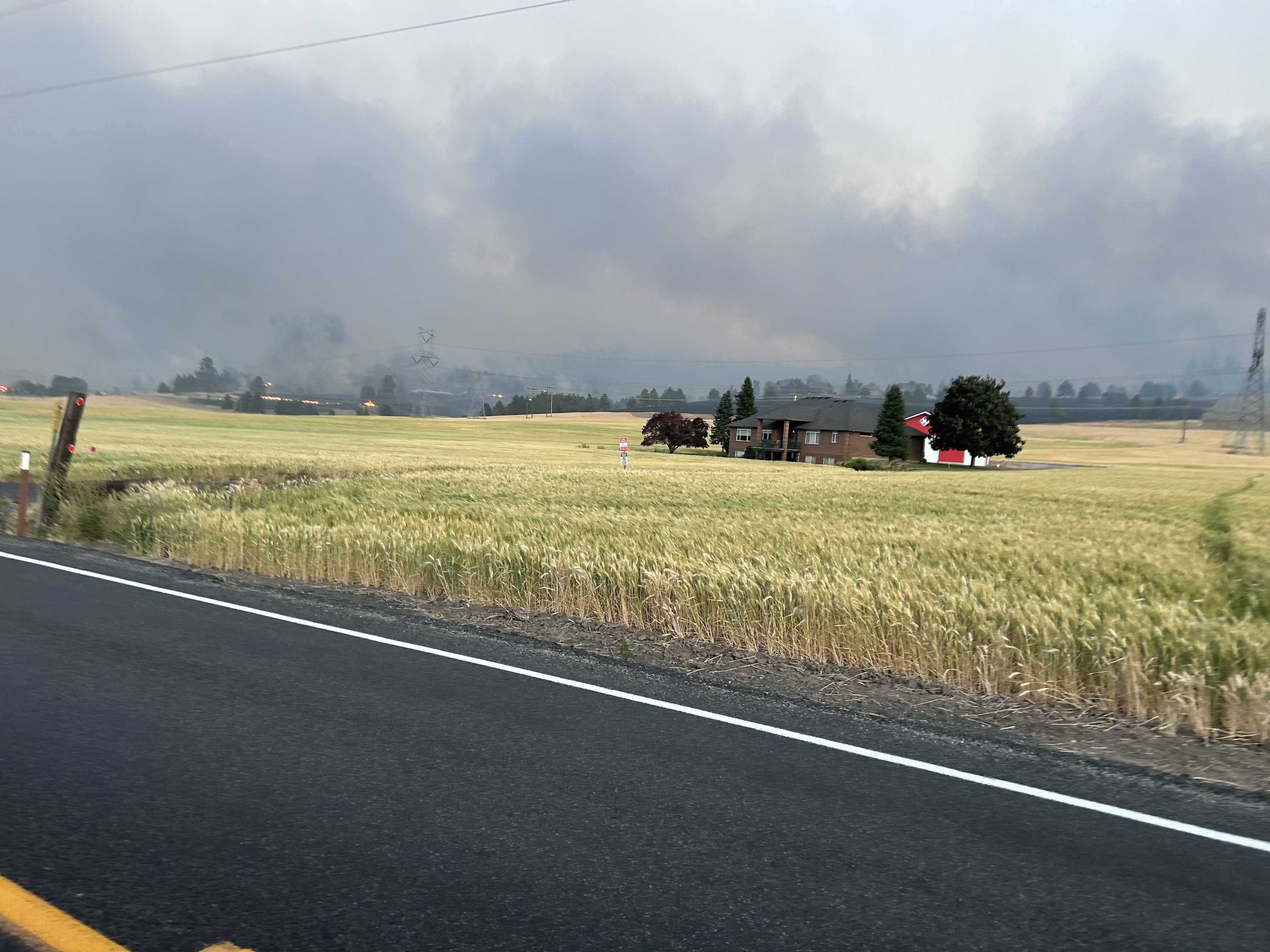 Smoke towers on the horizon amid widespread wildfires in the Spokane, Washington, region on Aug. 3, 2026. | Credit: Shane Stocking