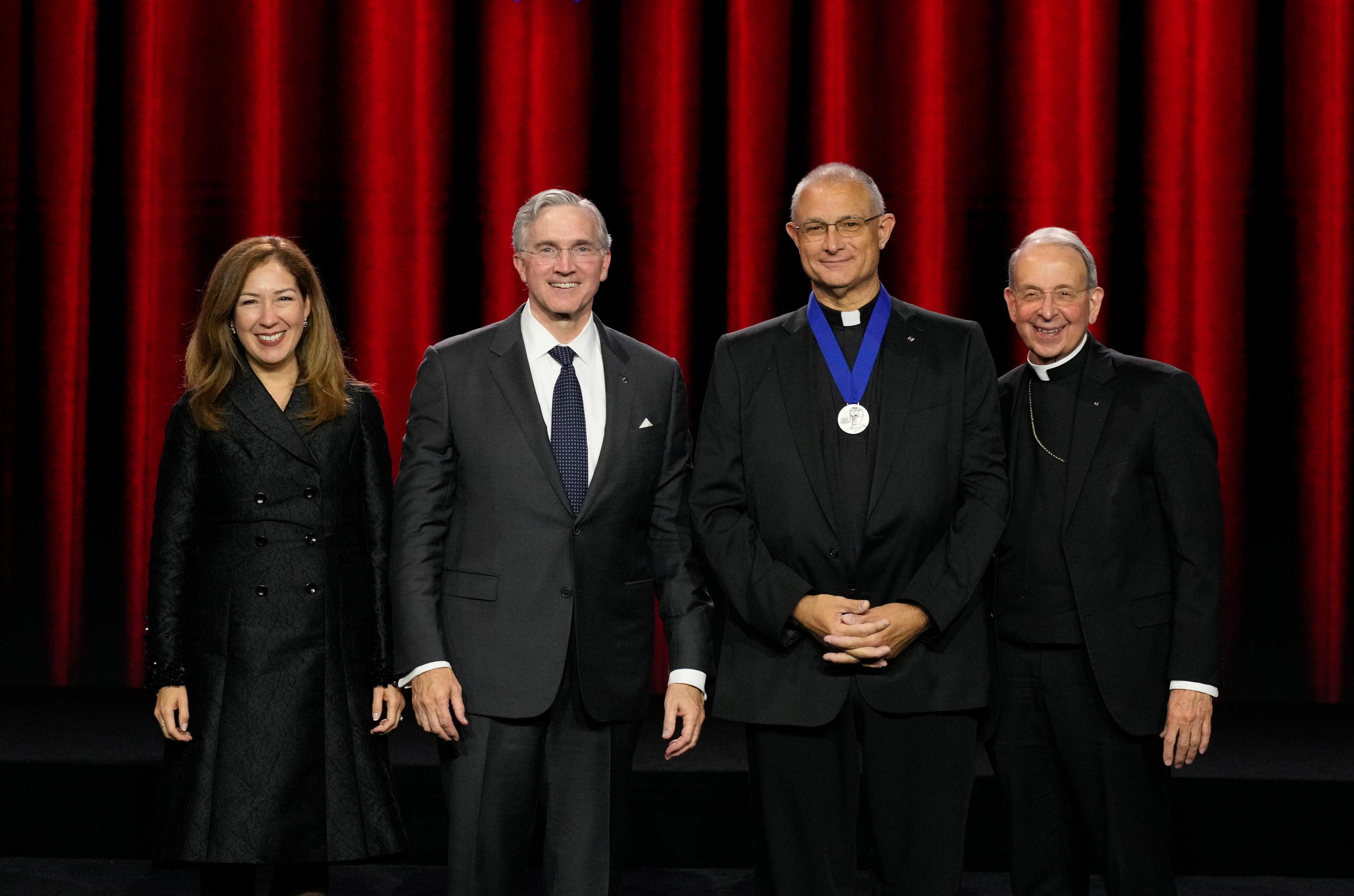 South Carolina State Chaplain Father Robert F. Higgins, winner of the Blessed Michael McGivney Medal, stands with Supreme Knight Patrick Kelly and his wife, Vanessa, and Supreme Chaplain Archbishop William E. Lori during the Supreme Knight’s Awards Session on Aug. 3, 2026, in Denver, ahead of the 144th Supreme Convention of the Knights of Columbus. | Credit: Photo courtesy of Paul Haring/Knights of Columbus