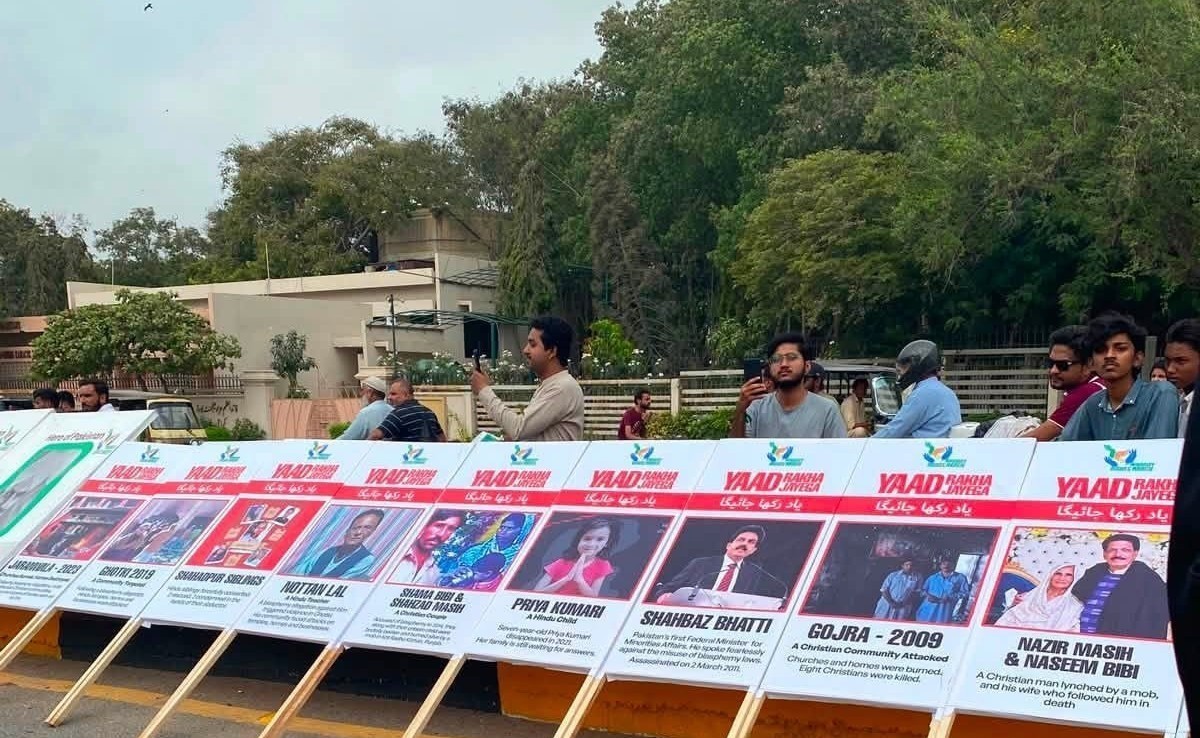 Placards commemorating victims of mob lynchings, forced conversions, blasphemy-related attacks, and assassinated Christian leaders line a National Minorities Day protest at the mausoleum of Pakistan's founder, Muhammad Ali Jinnah, in Karachi on Aug. 11, 2026. | Credit: Photo courtesy of Luke Victor