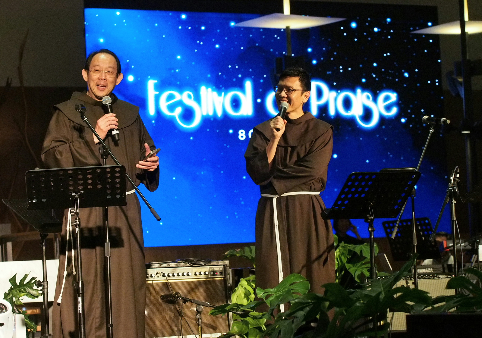 Friar Derrick Yap, left, and Friar John-Paul Tan of the Custody of St. Anthony speak at the Festival of Praise event at the Church of St. Mary of the Angels in Singapore. | Credit: Courtesy of Cantiva Studios