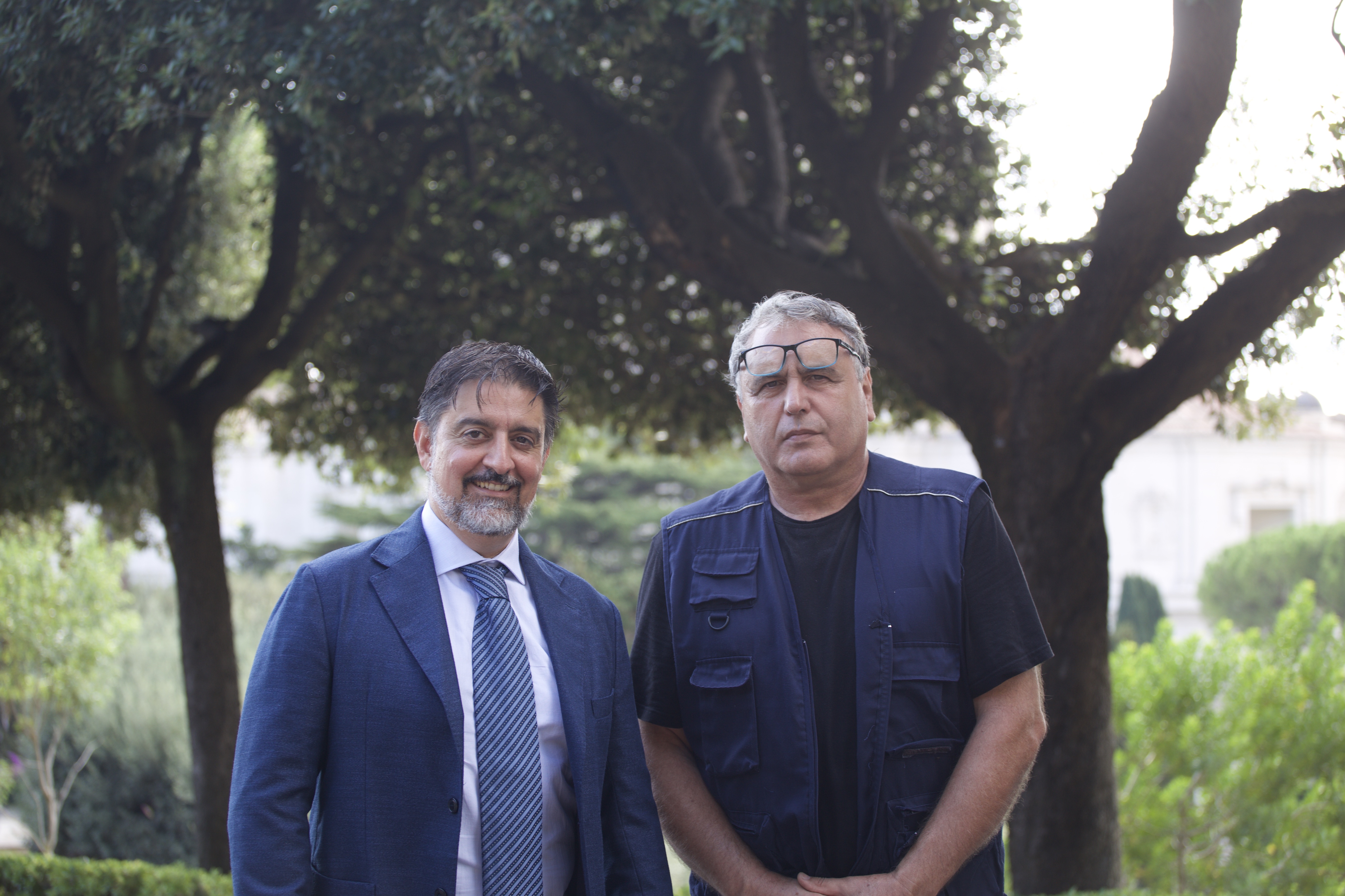 Stefano Giampaolo, left, head of the Gardens and Environment Service of Vatican City, and expert gardener Gilberto Bianchi, right, the main caretaker of the orchard and vegetable garden commonly known as “the pope’s garden,” share their expertise with EWTN News in the Vatican Gardens on Sept. 9, 2026. | Credit: Hannah Brockhaus/EWTN News